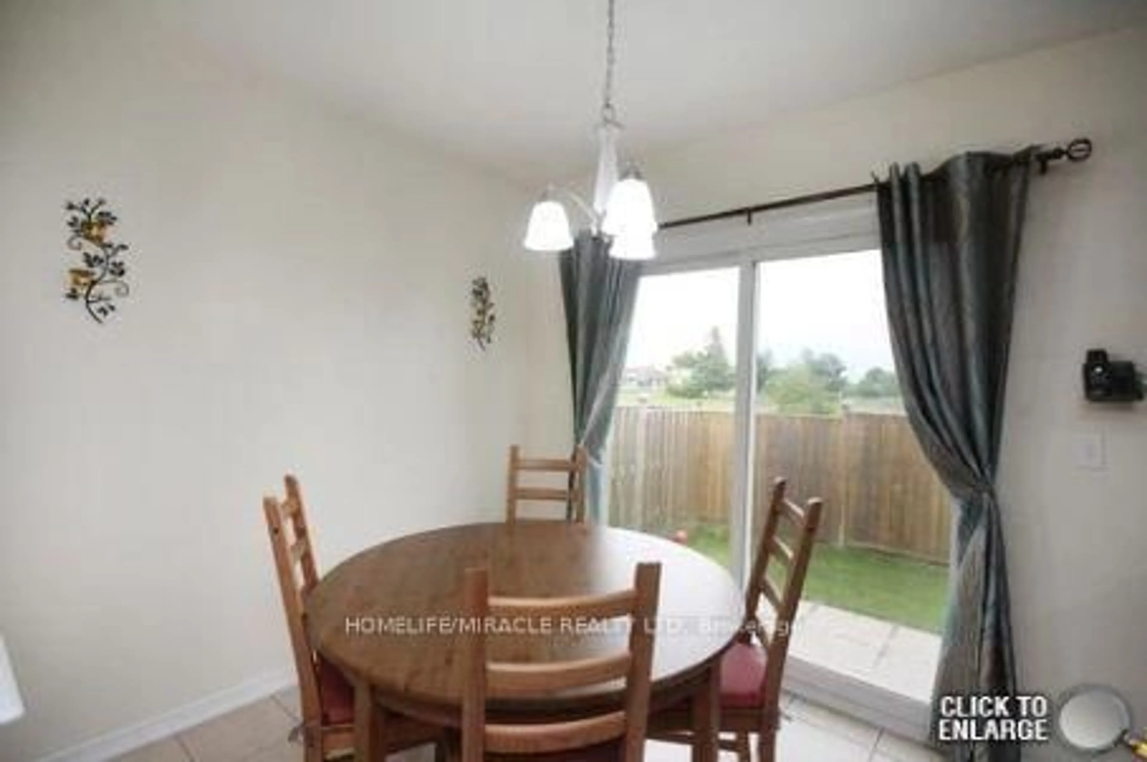 Dining room, wood/laminate floor for 16 Unionville Cres, Brampton Ontario L6P 2Z4