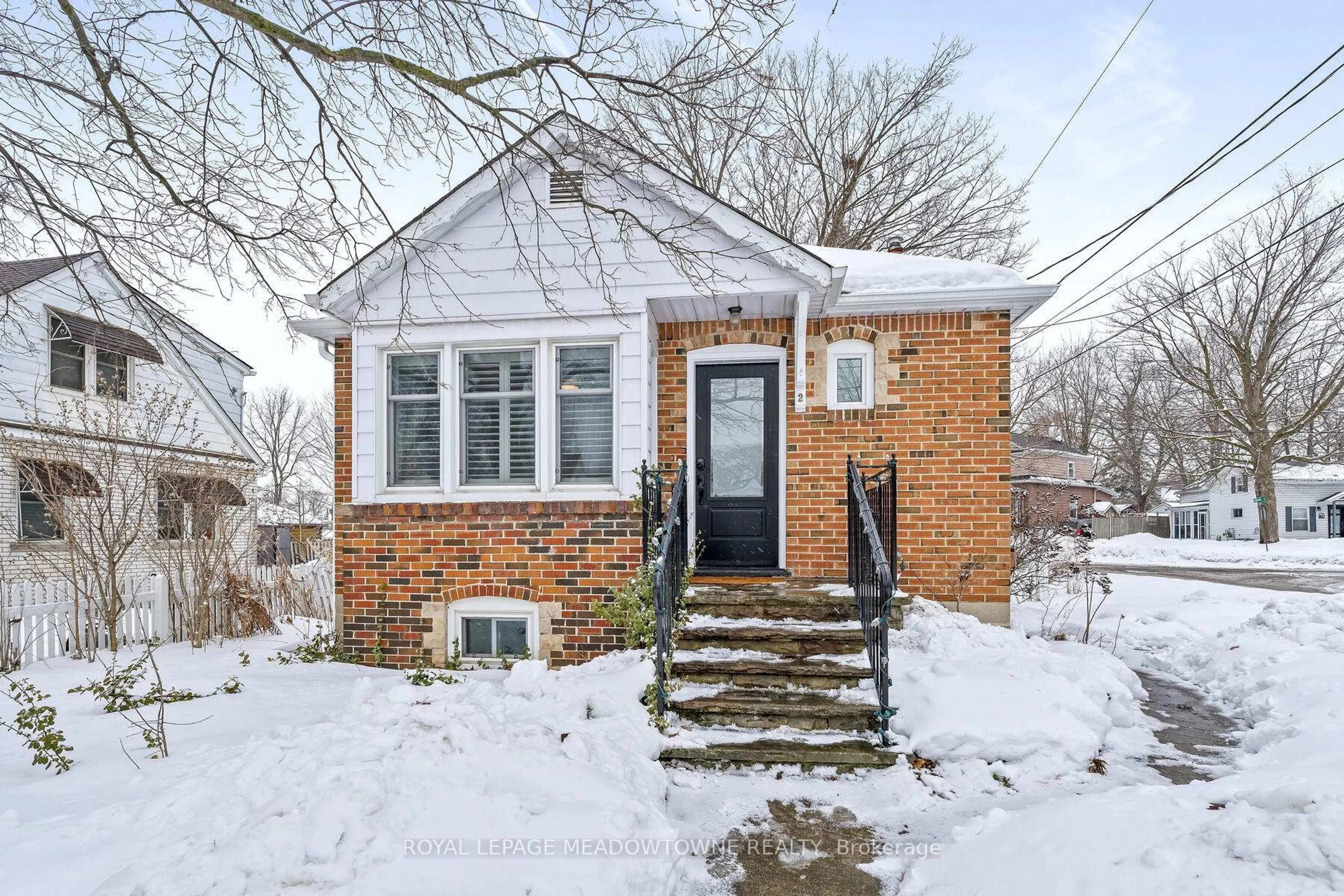 Home with brick exterior material, street for 2 Ostrander Blvd, Halton Hills Ontario L7G 1Z3