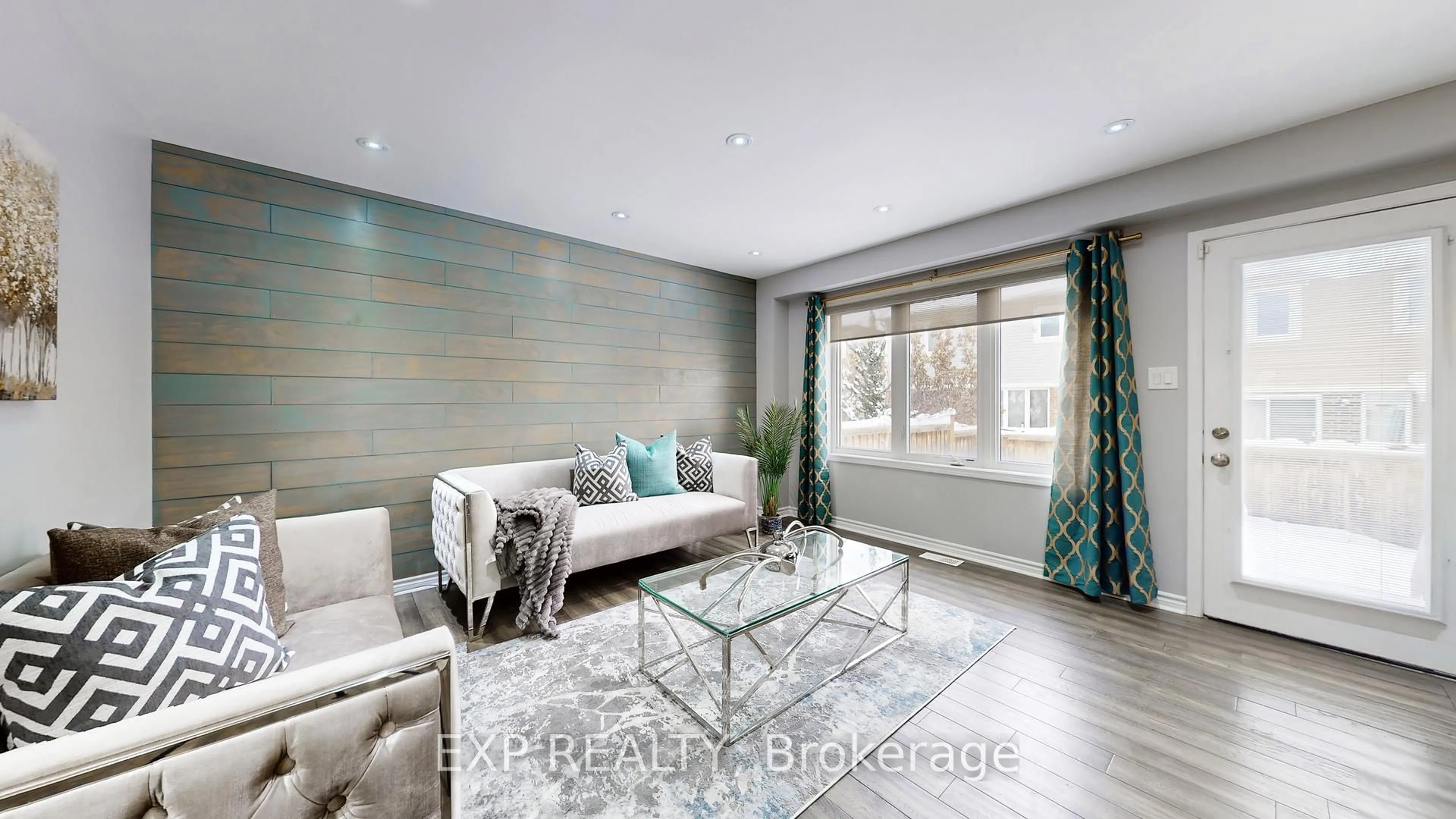 Living room with furniture, wood/laminate floor for 27 Leadenhall Rd, Brampton Ontario L7A 4G4