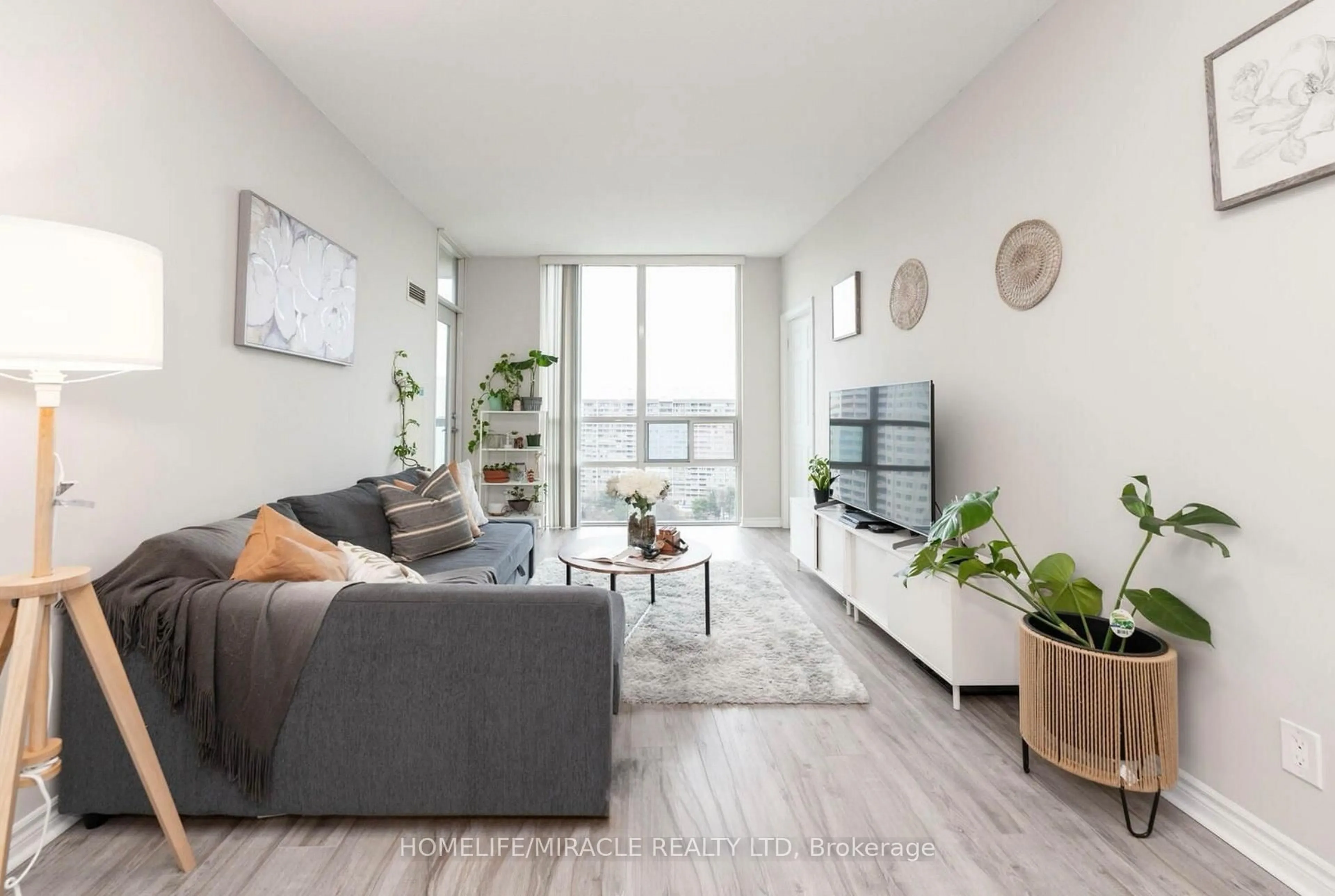 Living room with furniture, wood/laminate floor for 3504 Hurontario St #1702, Mississauga Ontario L5B 0B9