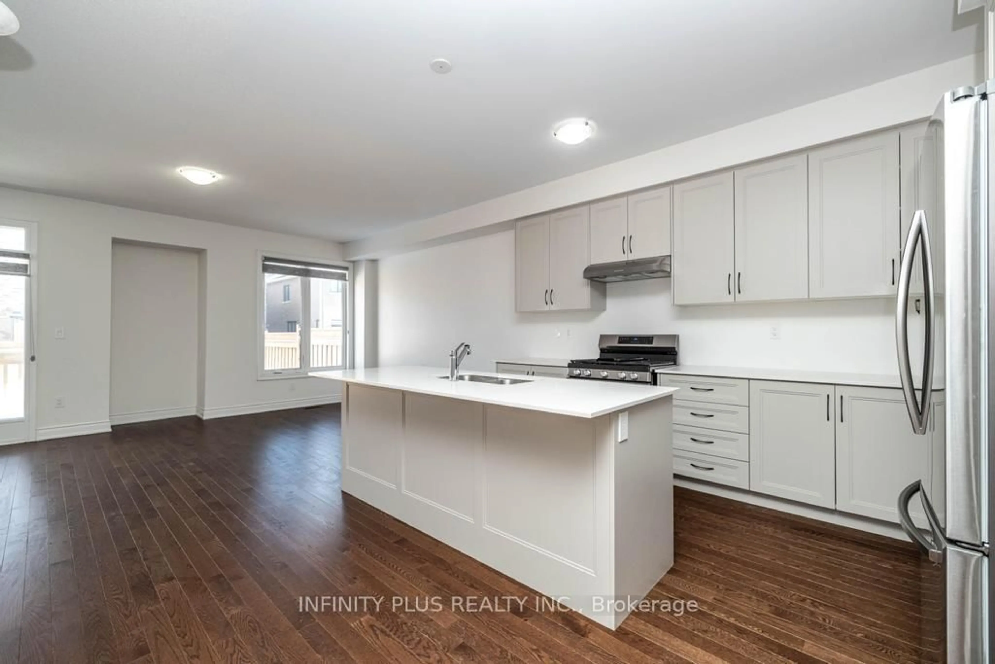 Open concept kitchen, wood/laminate floor for 9 Fordham Rd, Brampton Ontario L6Y 6K2