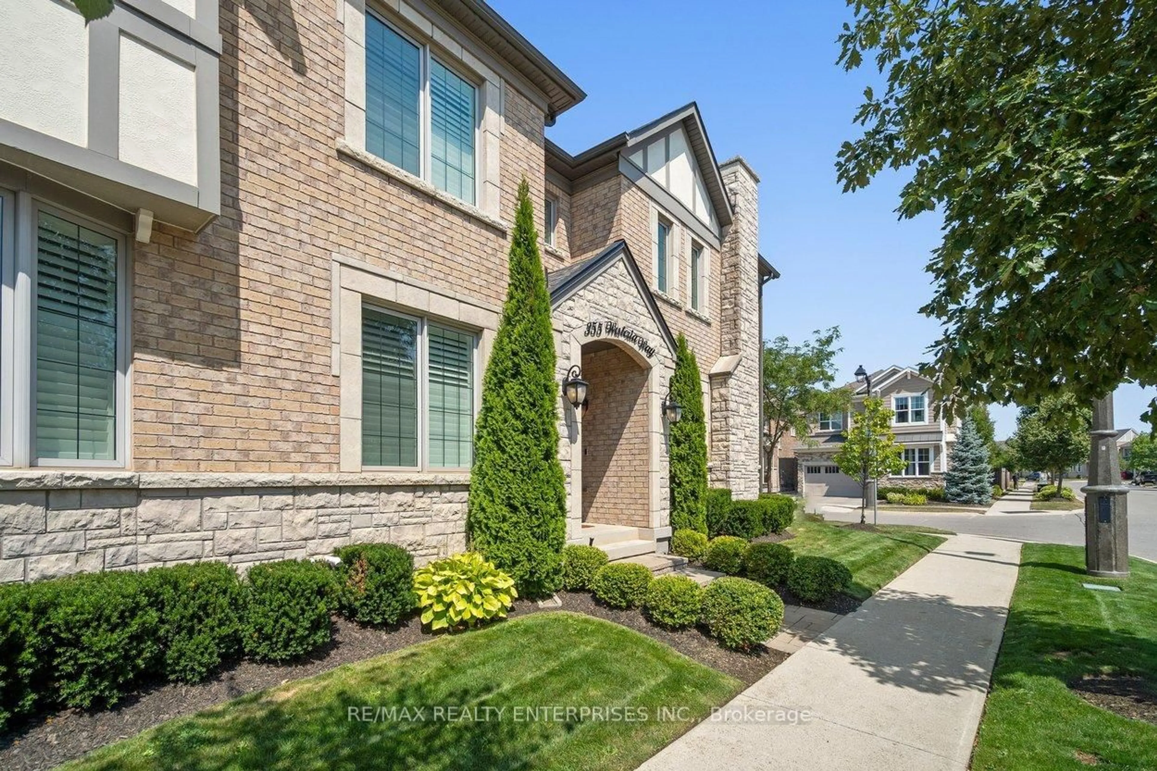 Home with brick exterior material, street for 355 Wisteria Way, Oakville Ontario L6M 1L6