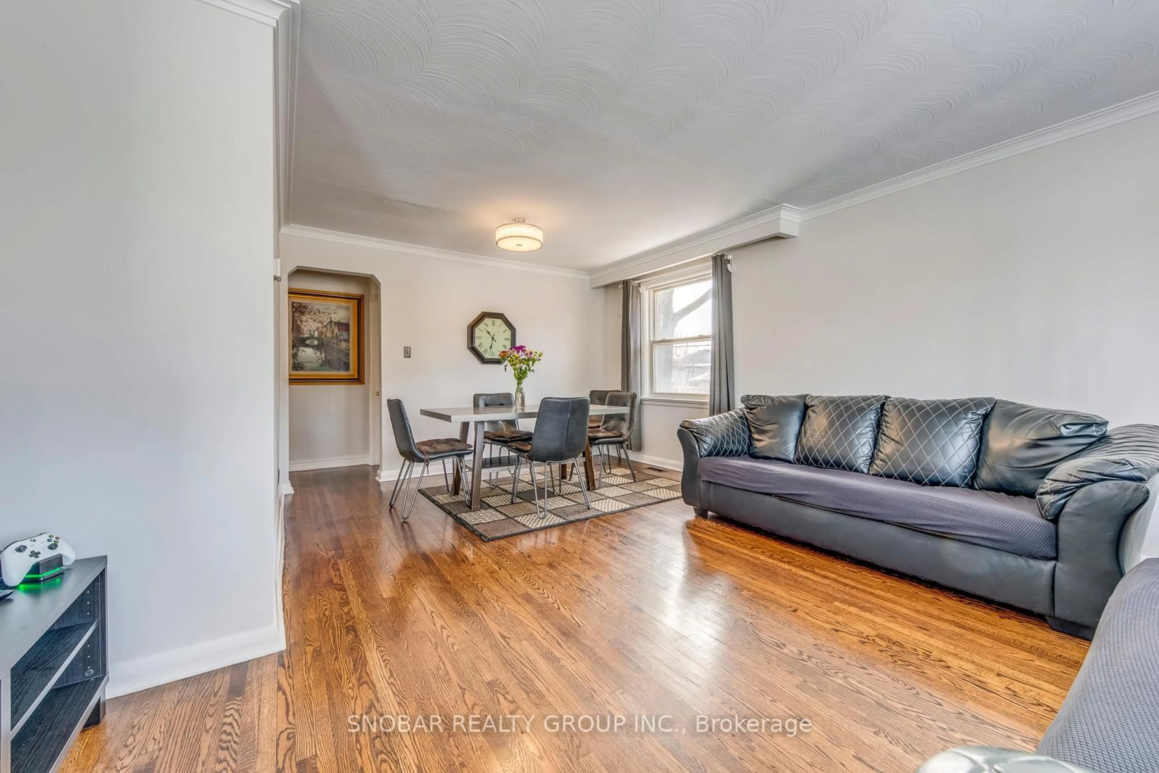 Living room with furniture, wood/laminate floor for 25 Allonsius Dr, Toronto Ontario M9C 3N4