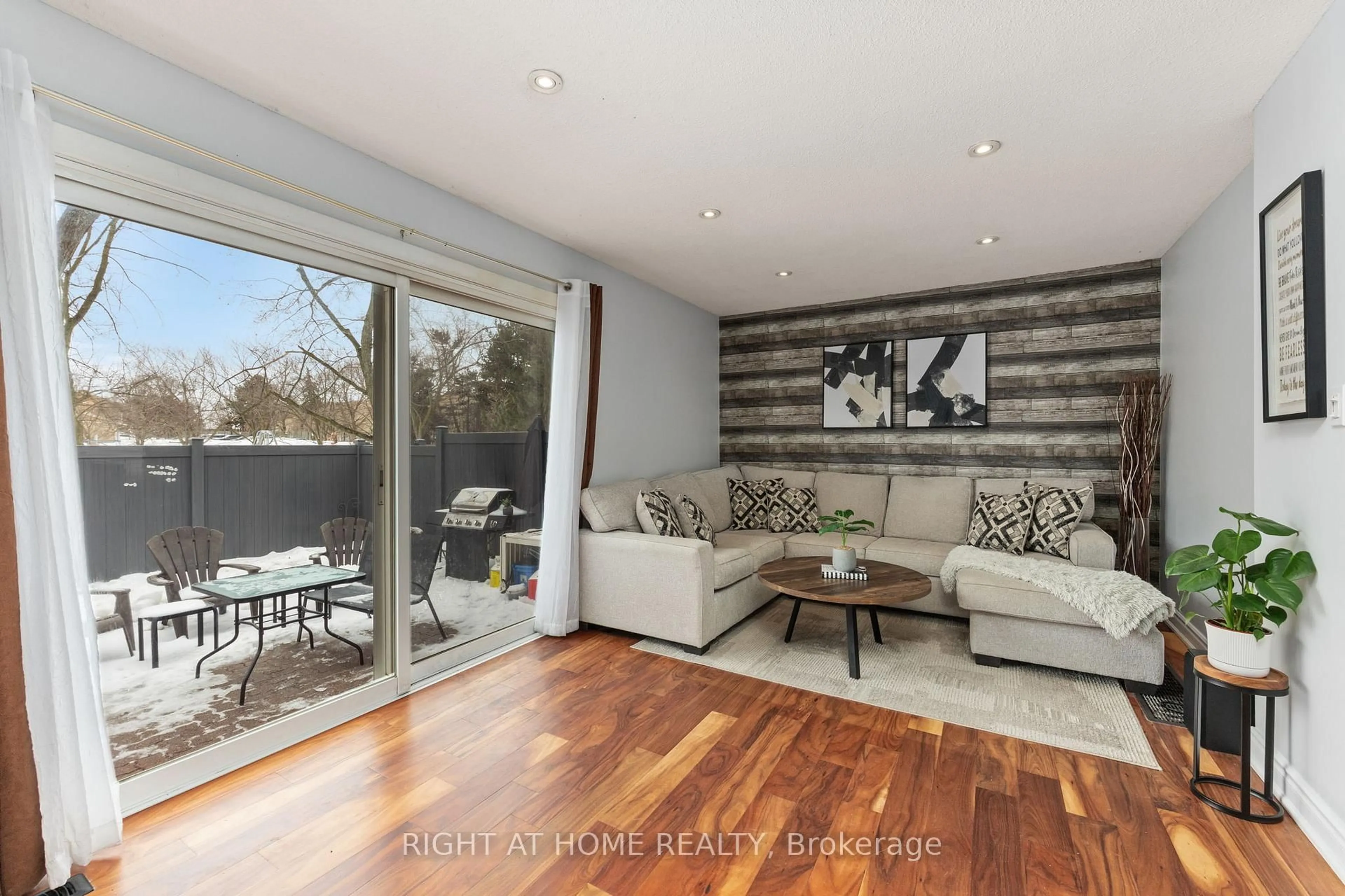 Living room with furniture, wood/laminate floor for 120 Falconer Dr #25, Mississauga Ontario L5N 1P5