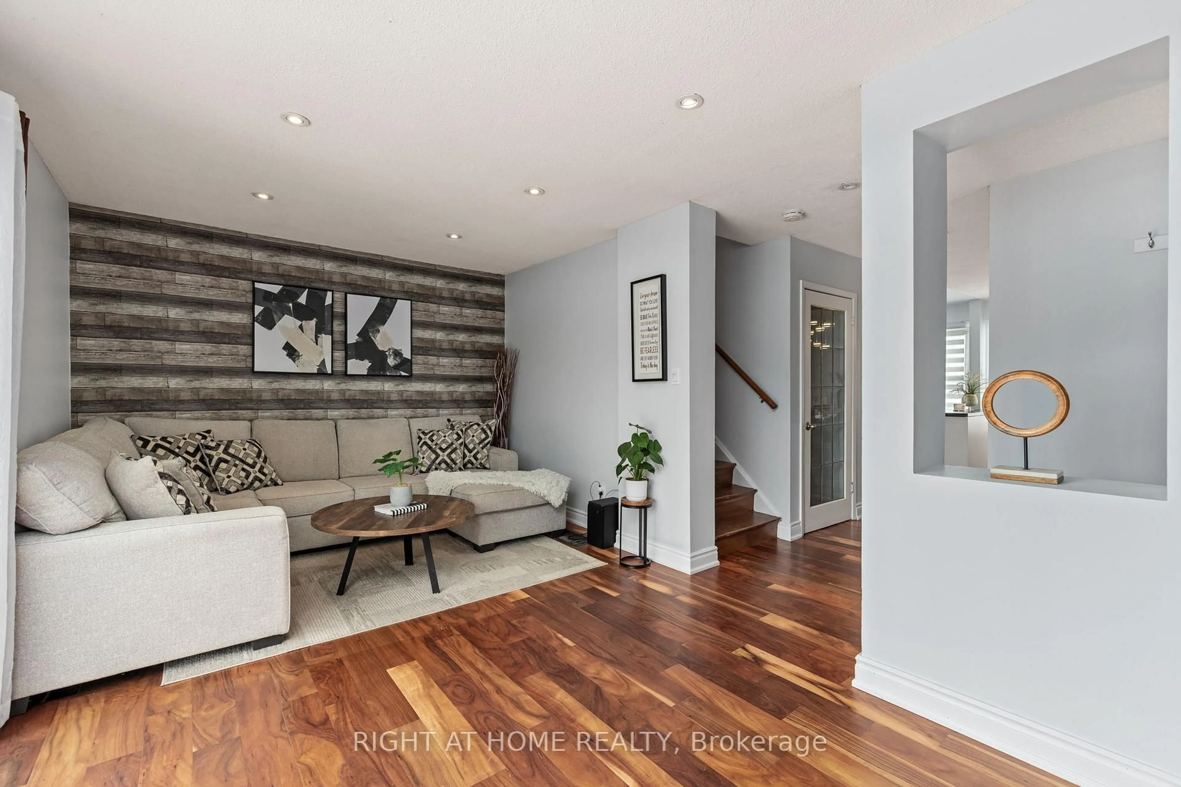 Living room with furniture, wood/laminate floor for 120 Falconer Dr #25, Mississauga Ontario L5N 1P5