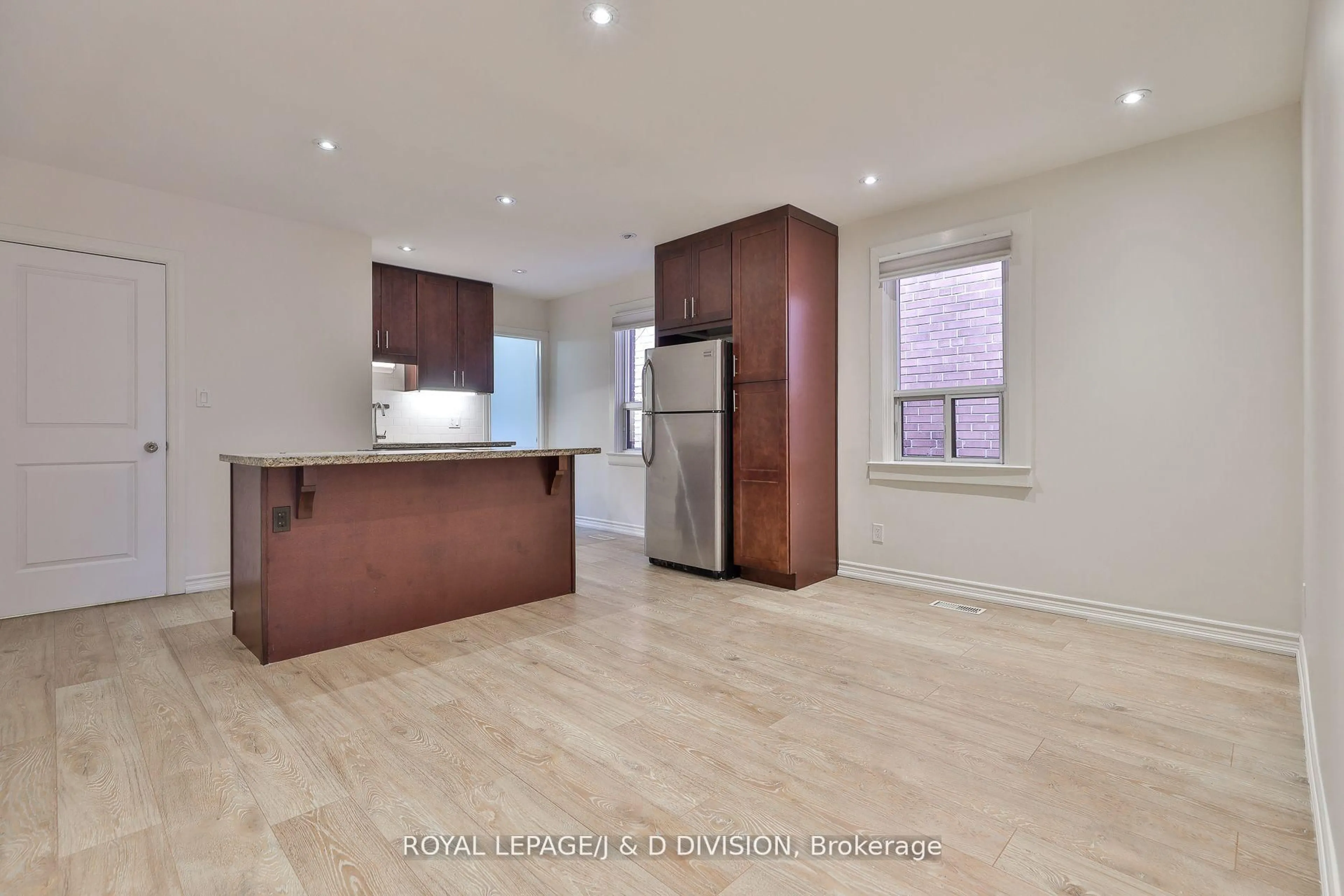 Open concept kitchen, wood/laminate floor for 22 Holmesdale Rd, Toronto Ontario M6E 1Y1