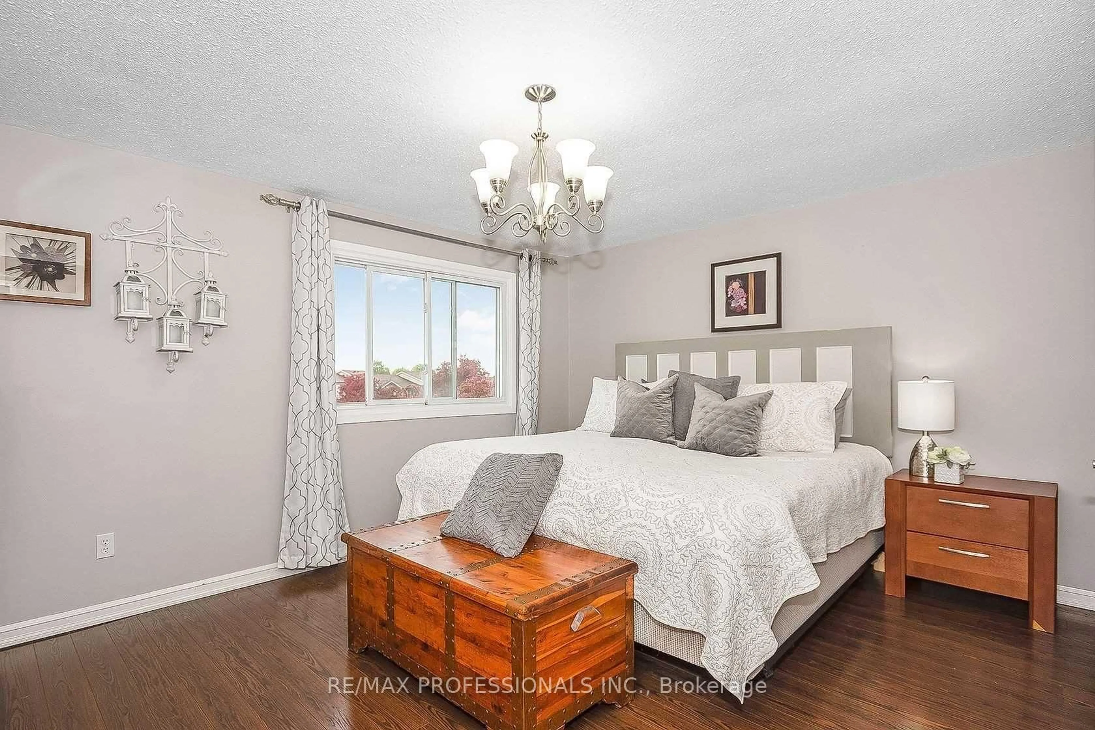 Bedroom with bed, wood/laminate floor for 180 Royal Salisbury Way, Brampton Ontario L6V 3J9