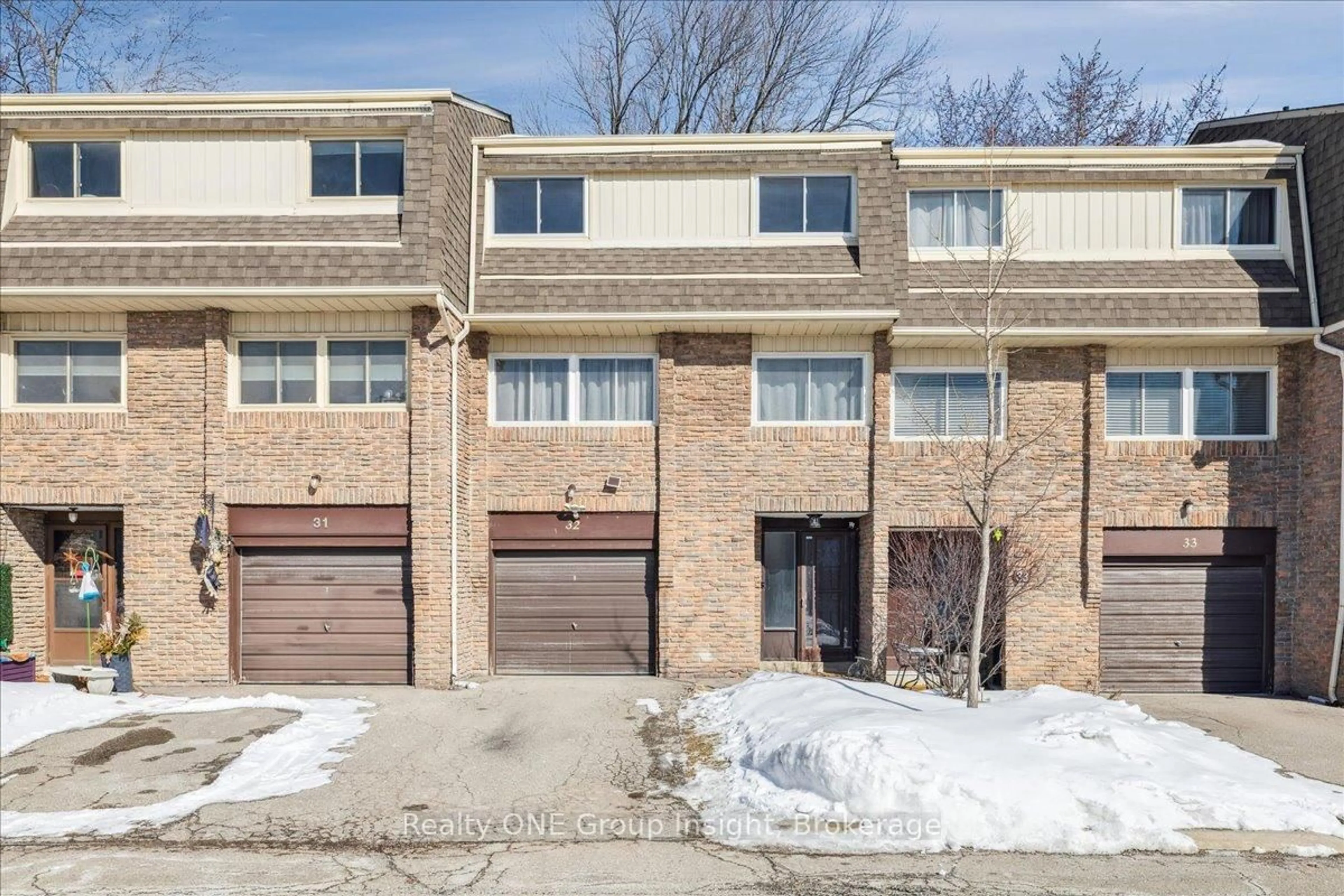Home with brick exterior material, street for 7430 Copenhagen Rd #32, Mississauga Ontario L5N 2C4