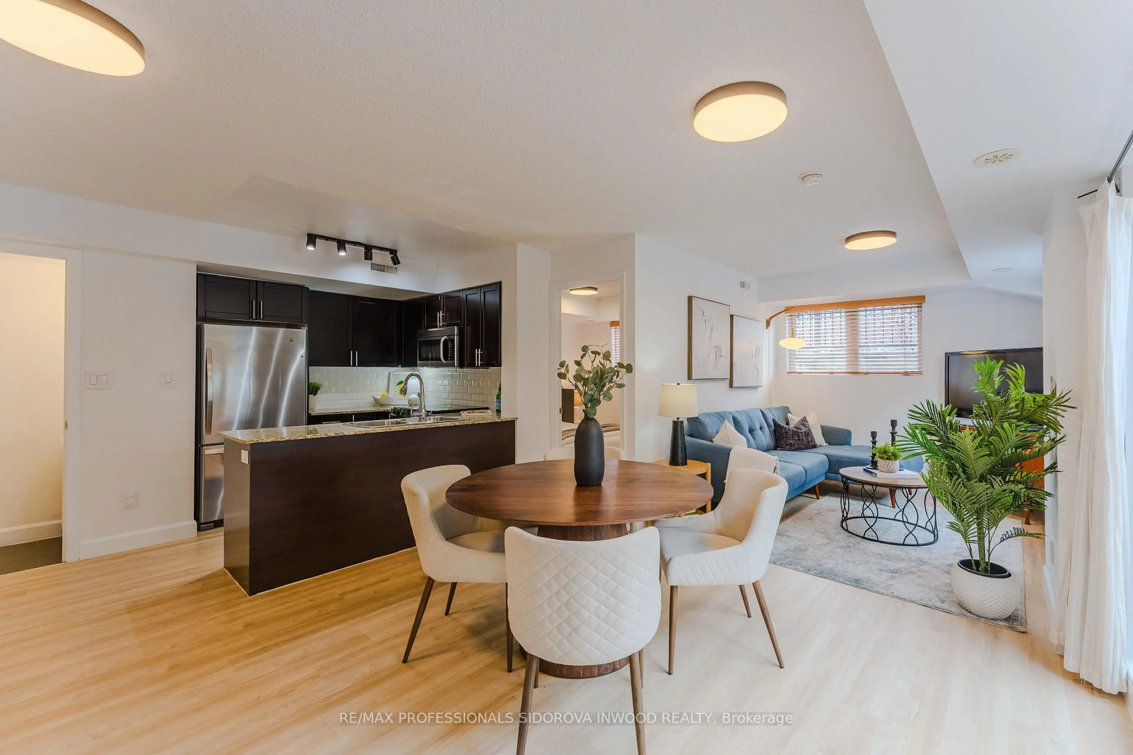 Open concept kitchen, wood/laminate floor for 14 Foundry Ave #115, Toronto Ontario M6H 0A8