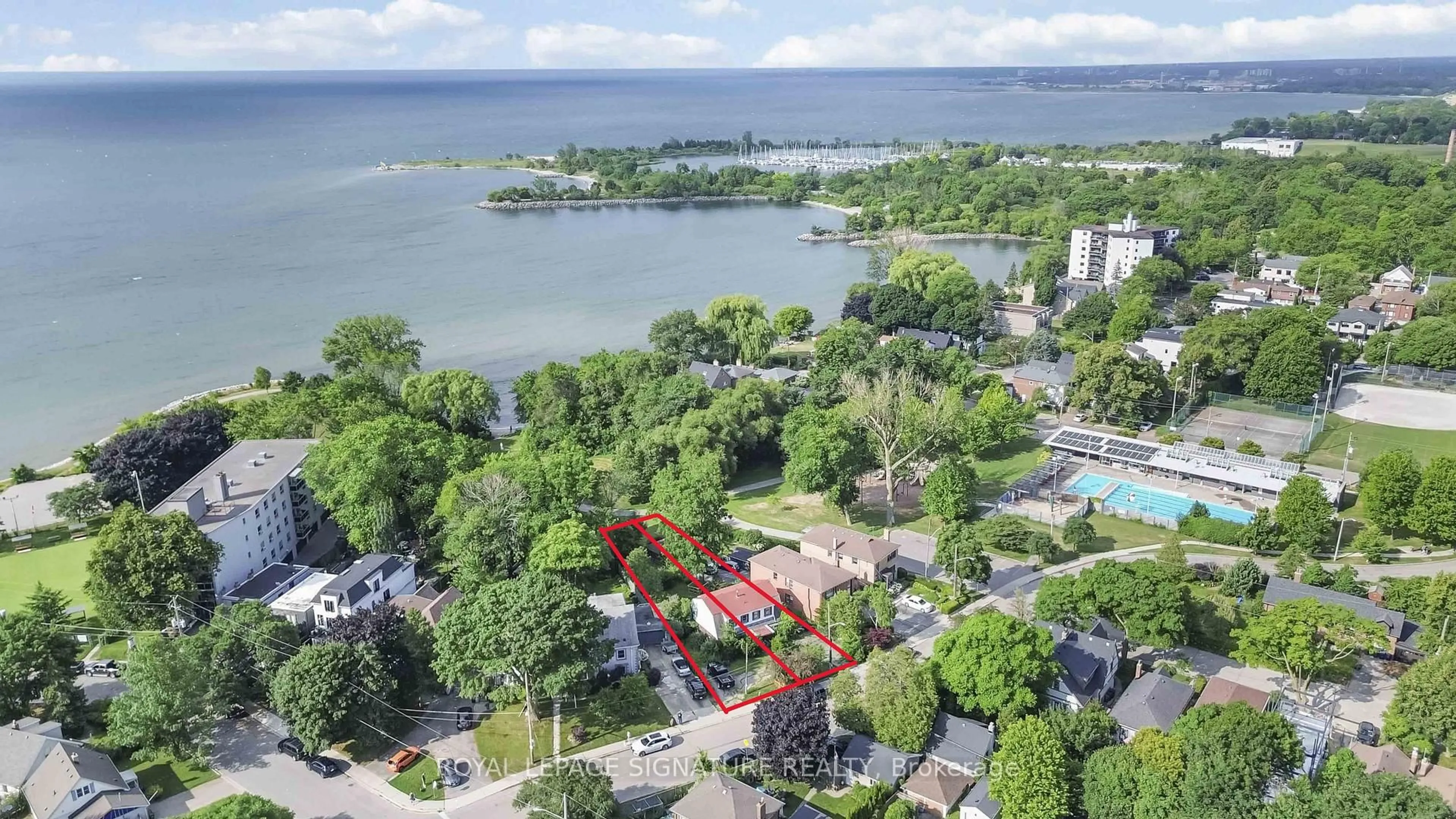 A pic from outside/outdoor area/front of a property/back of a property/a pic from drone, water/lake/river/ocean view for 175 Lake Shore Dr, Toronto Ontario M8V 2A1