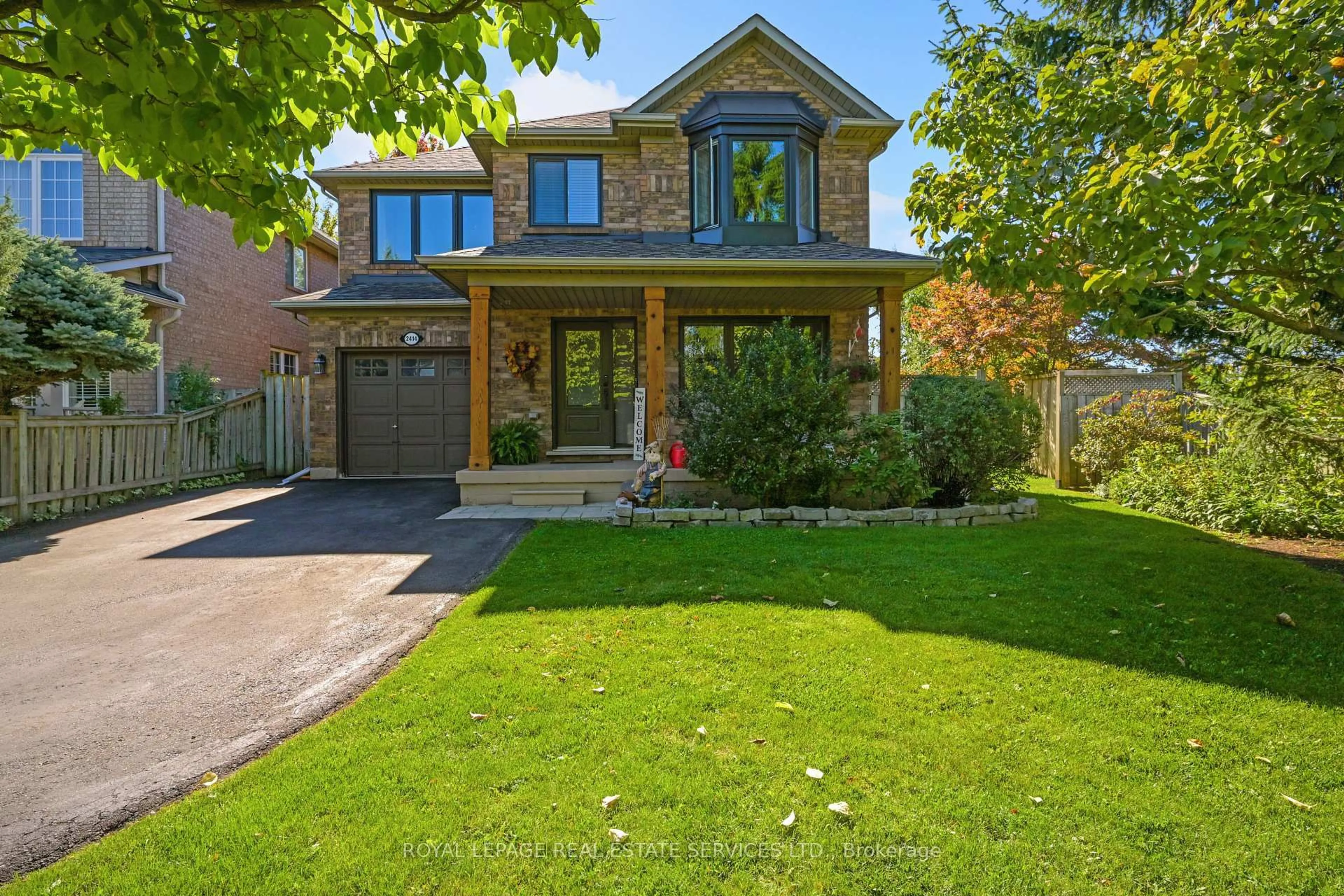 Home with brick exterior material, street for 2414 Proudfoot Tr, Oakville Ontario L6M 3Y1