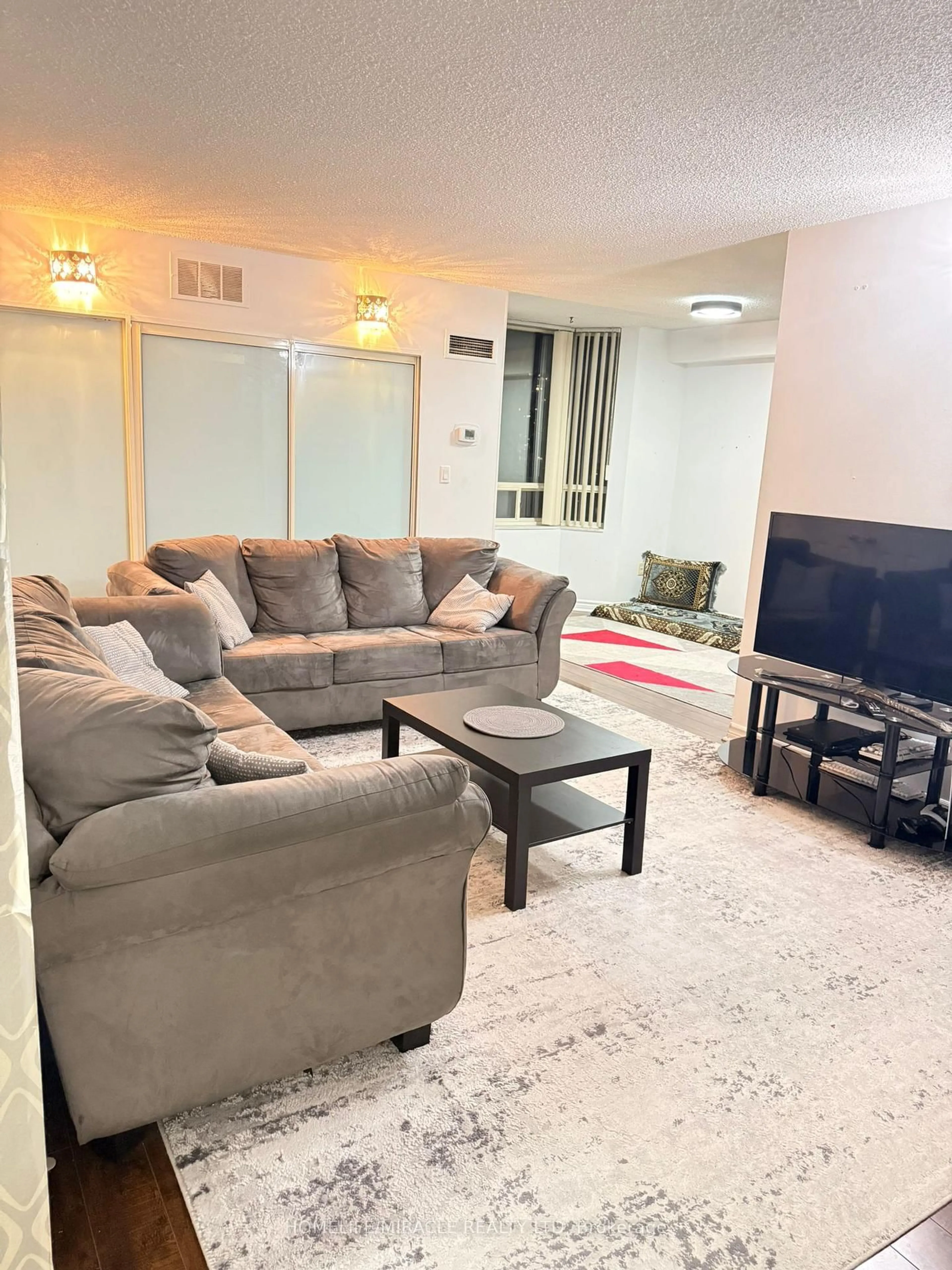 Living room with furniture, unknown for 5 Lisa St #409, Brampton Ontario L6T 4T4