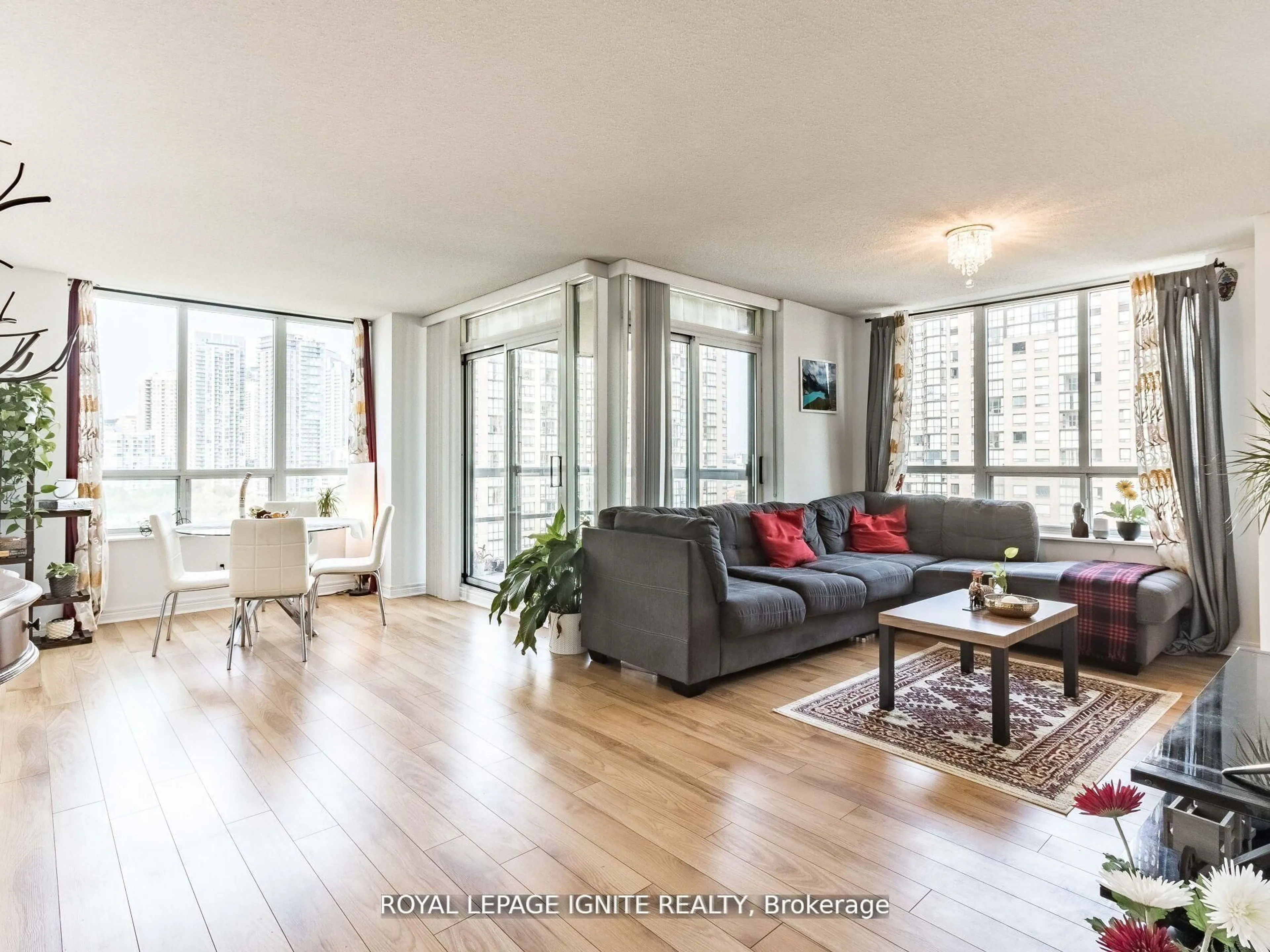 Living room with furniture, wood/laminate floor for 156 Enfield Pl #1711, Mississauga Ontario L5B 4L8