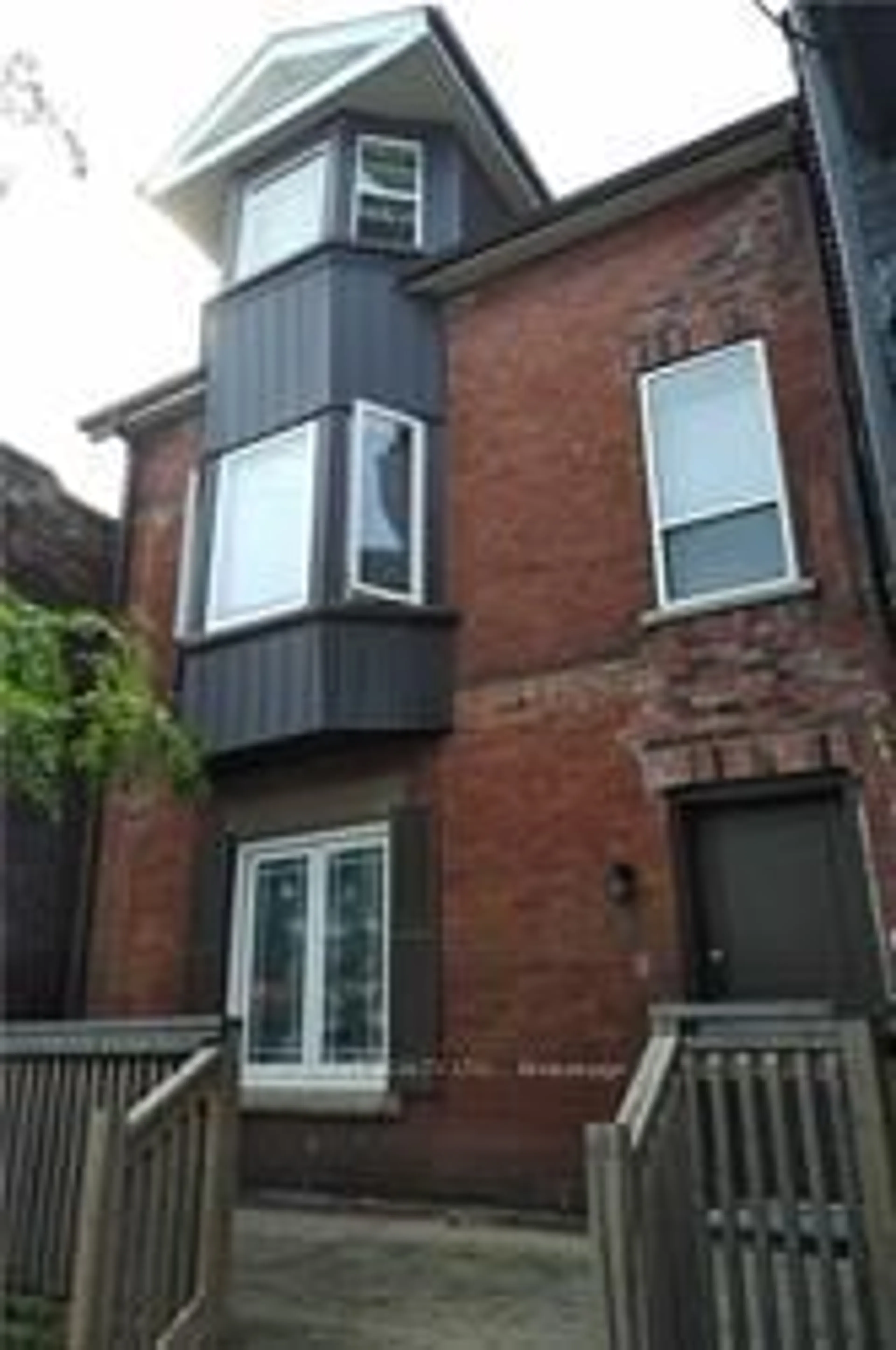 Home with brick exterior material, street for 2011 Dundas St, Toronto Ontario M6R 1W7