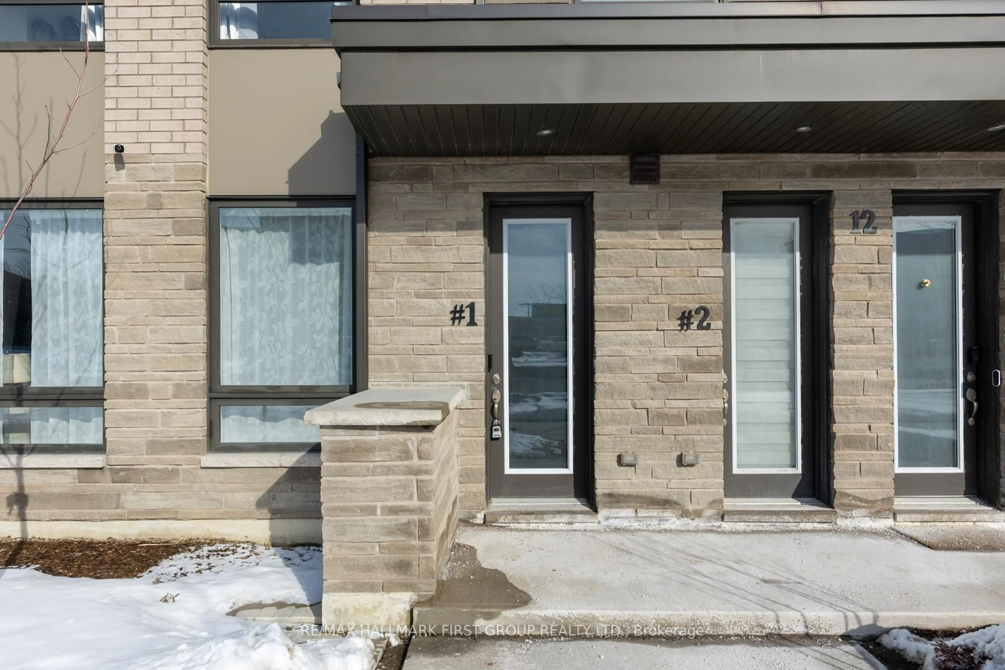 Home with brick exterior material, street for 12 Humberwood Blvd #1, Toronto Ontario M9W 0G1