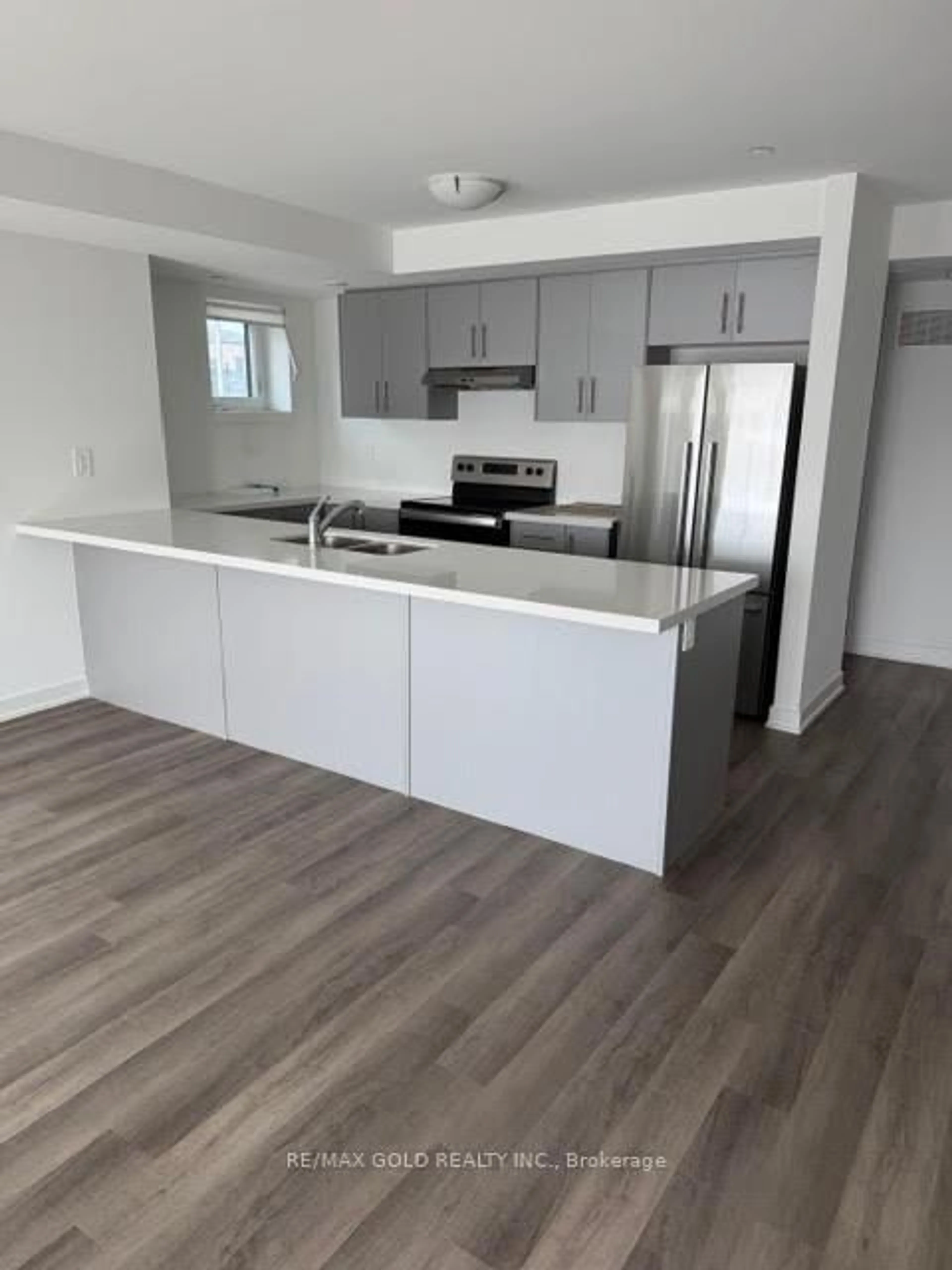 Open concept kitchen, wood/laminate floor for 5 Romilly Ave #1, Brampton Ontario L7A 5L8