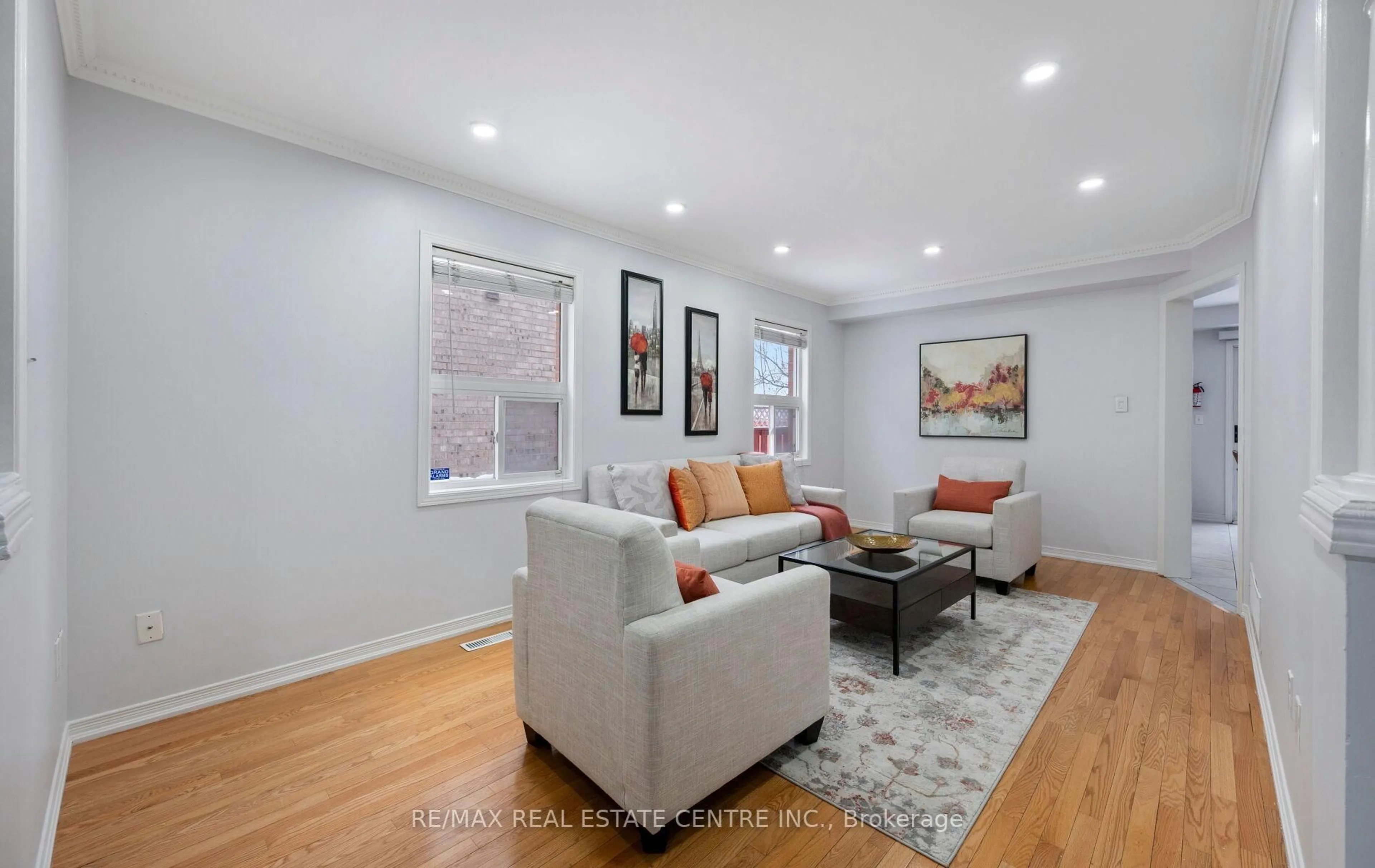 Living room with furniture, wood/laminate floor for 15 Revelstoke Pl, Brampton Ontario L6R 3G3