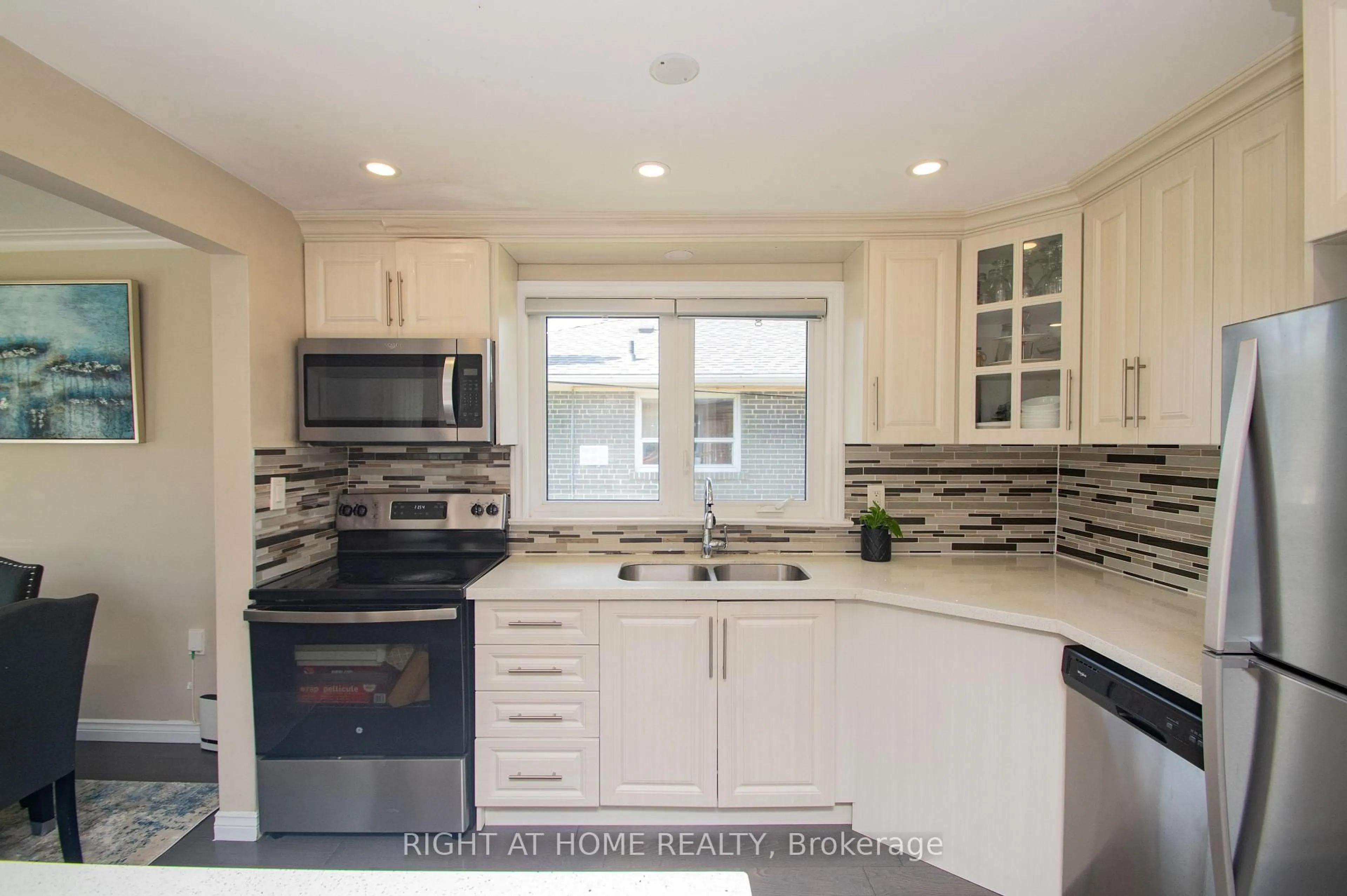 Open concept kitchen, ceramic/tile floor for 65 Bridgenorth Cres, Toronto Ontario M9V 2M5