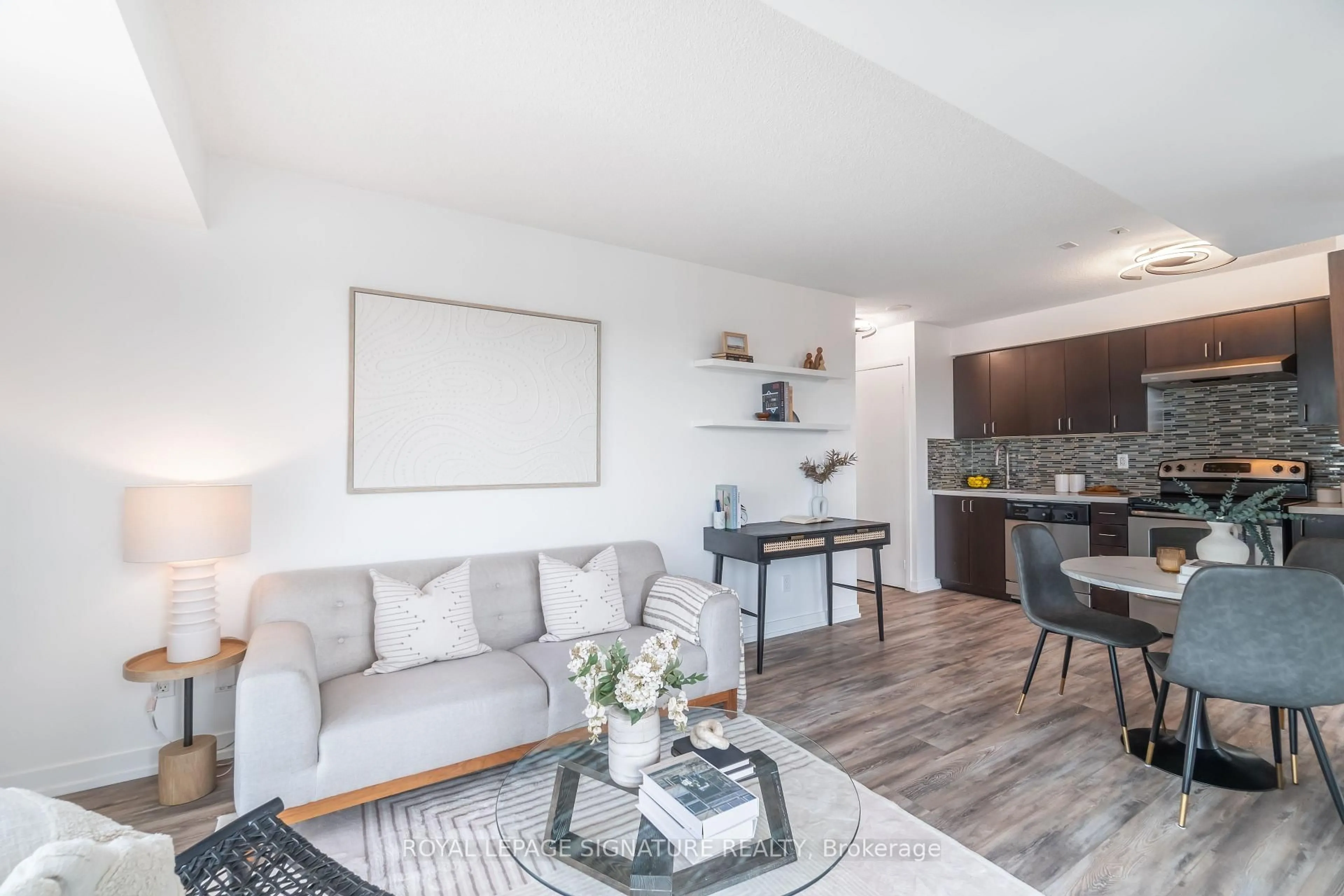 Living room with furniture, wood/laminate floor for 155 Legion Rd #1612, Toronto Ontario M8Y 0A7