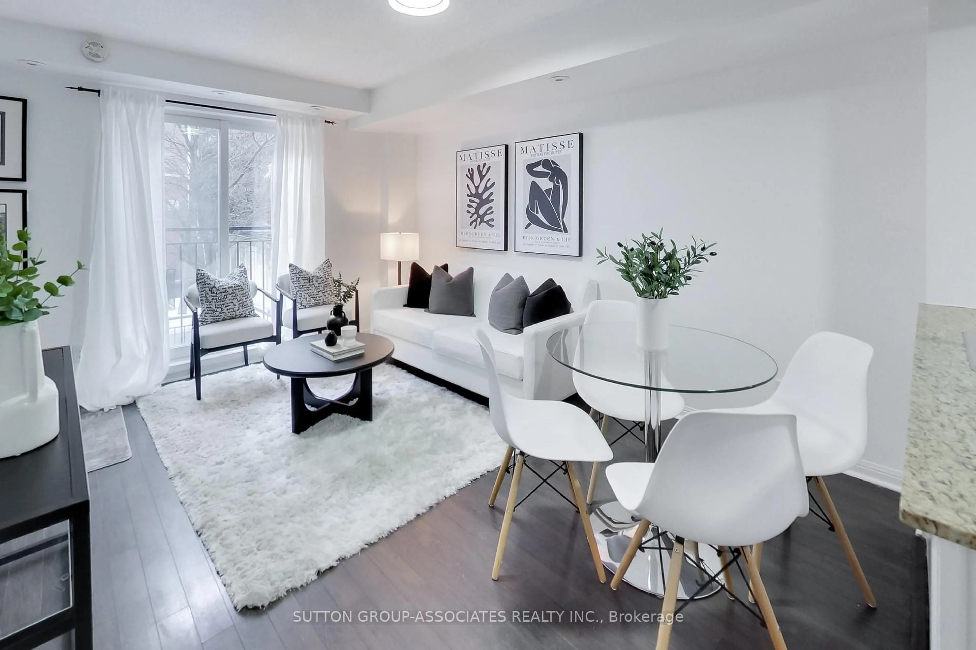 Living room with furniture, wood/laminate floor for 12 Laidlaw St #802, Toronto Ontario M6K 1X2