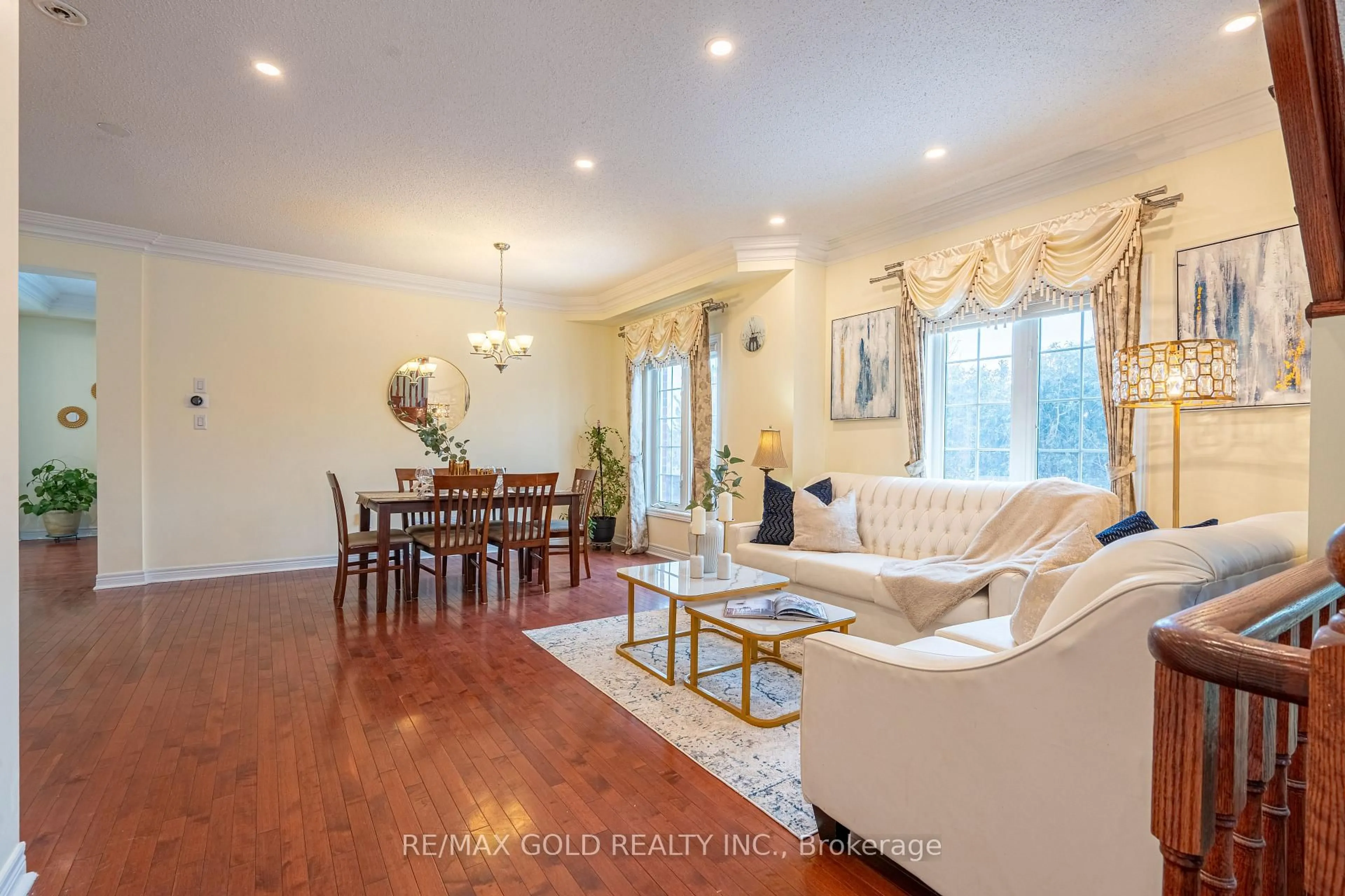 Living room with furniture, wood/laminate floor for 311 Father Tobin Rd, Brampton Ontario L6R 0P4