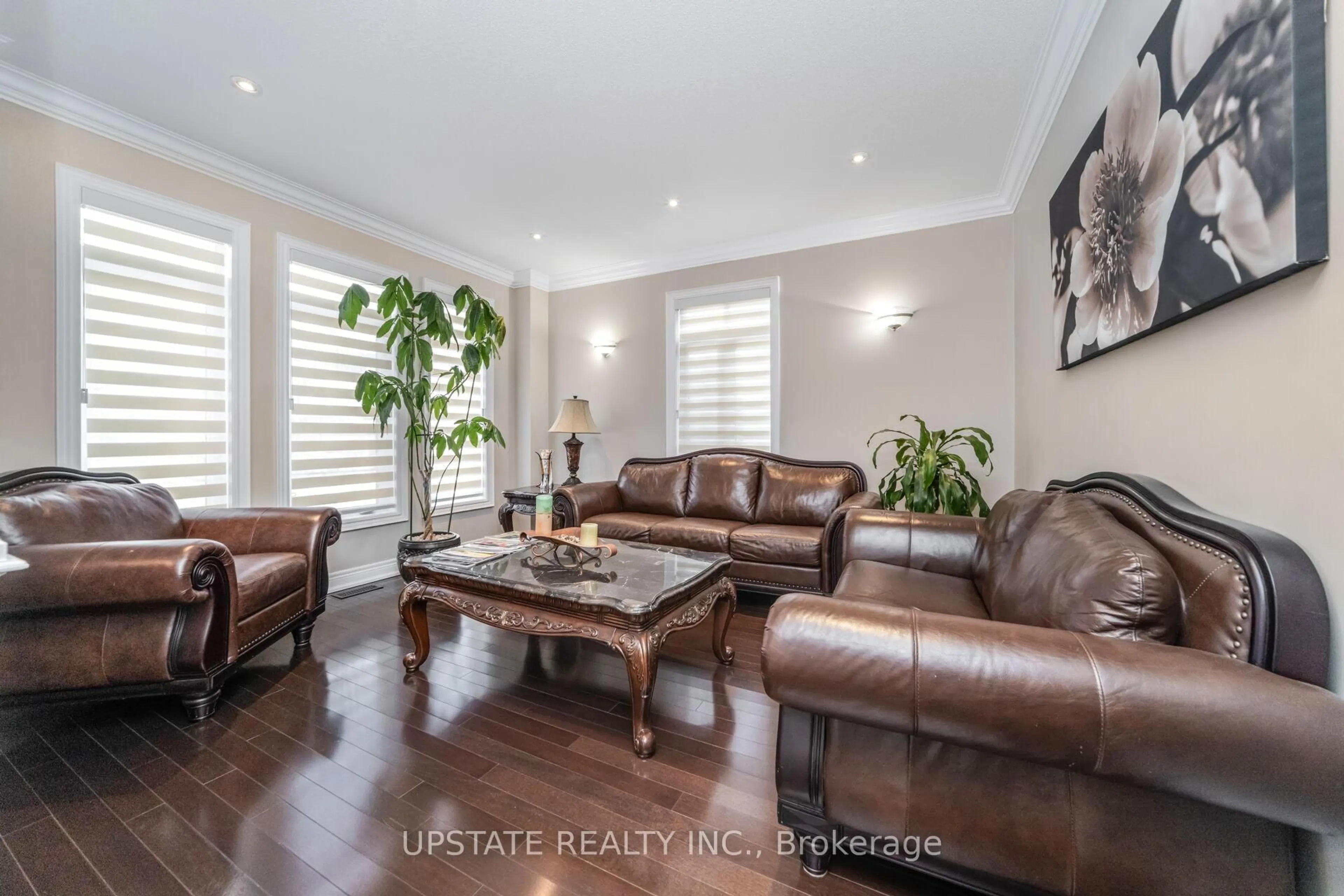 Living room with furniture, wood/laminate floor for 12 Haywood Dr, Brampton Ontario L6X 0W1