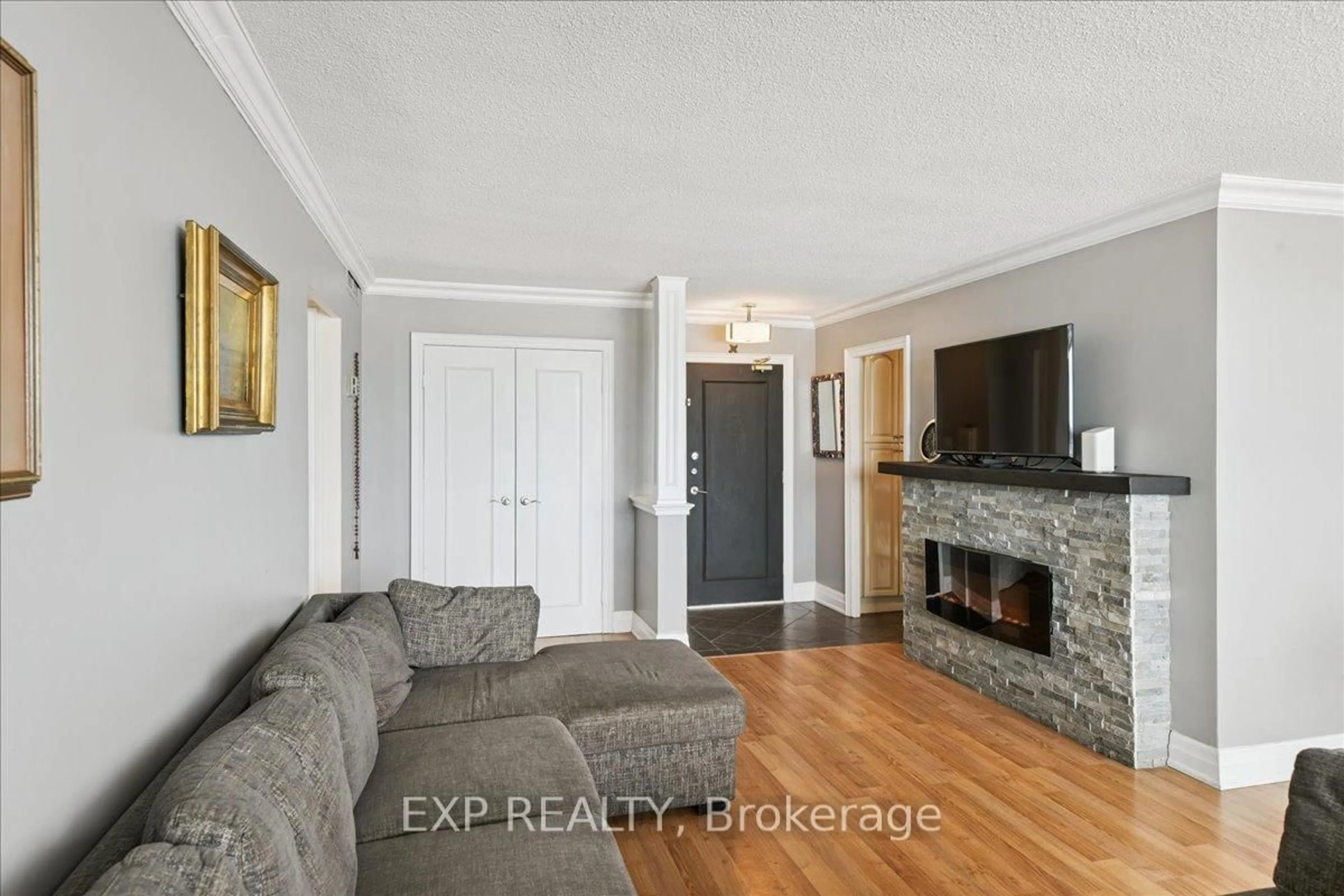 Living room with furniture, ceramic/tile floor for 44 Longbourne Dr #412, Toronto Ontario M9R 2M7