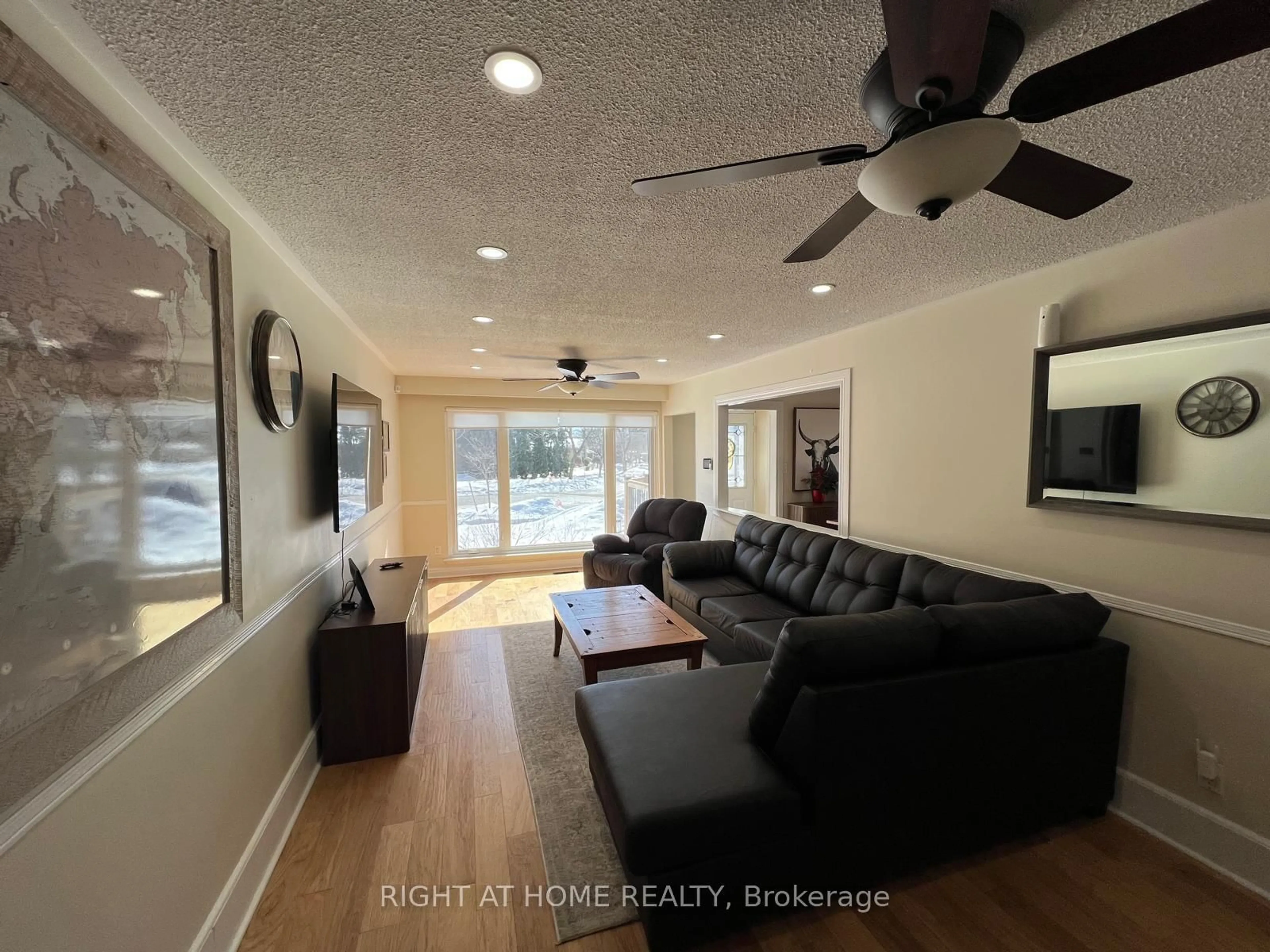 Living room with furniture, wood/laminate floor for 45 Newstead Cres, Brampton Ontario L6V 2A8