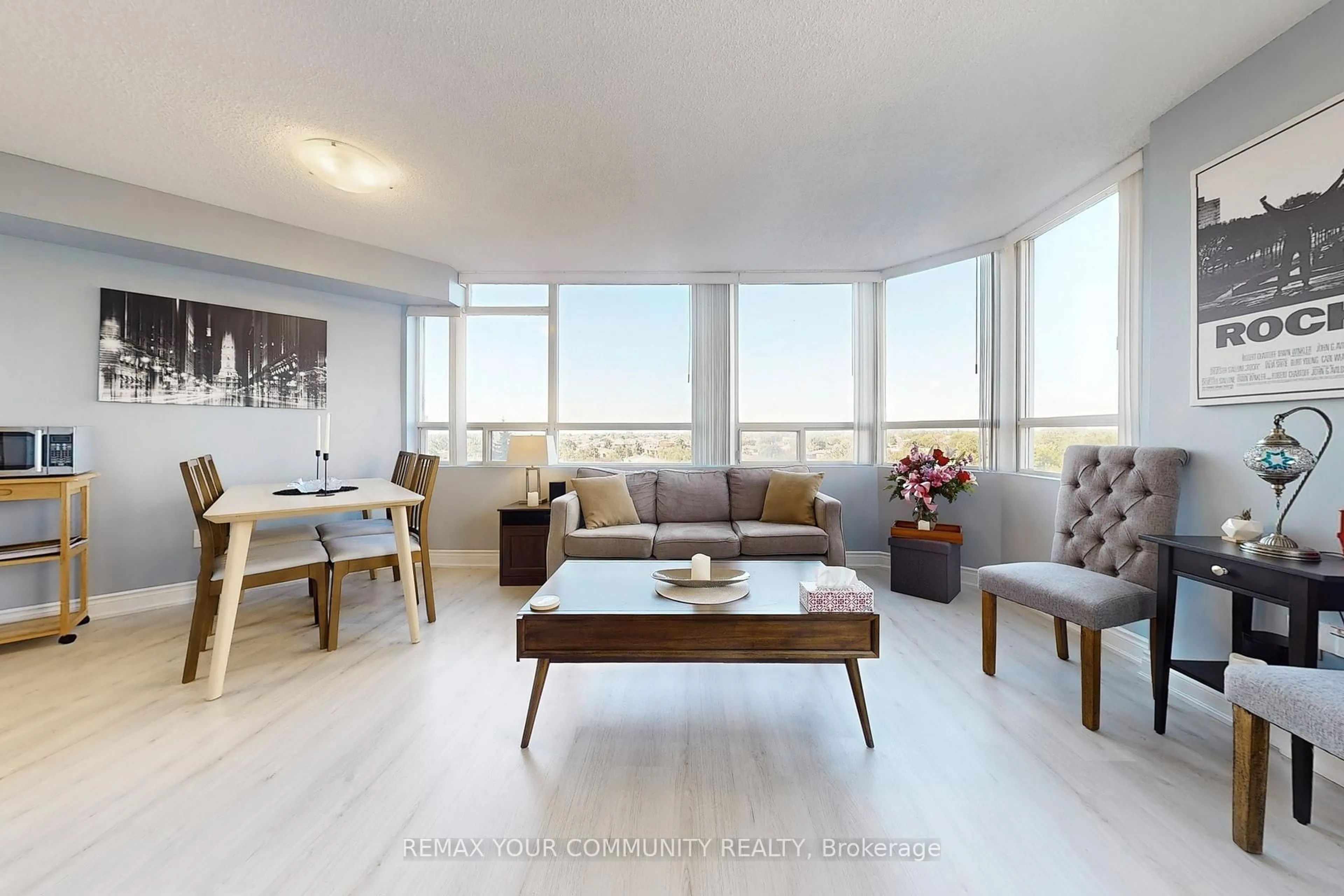 Living room with furniture, wood/laminate floor for 50 Kingsbridge Garden Circ #603, Mississauga Ontario L5R 1Y2