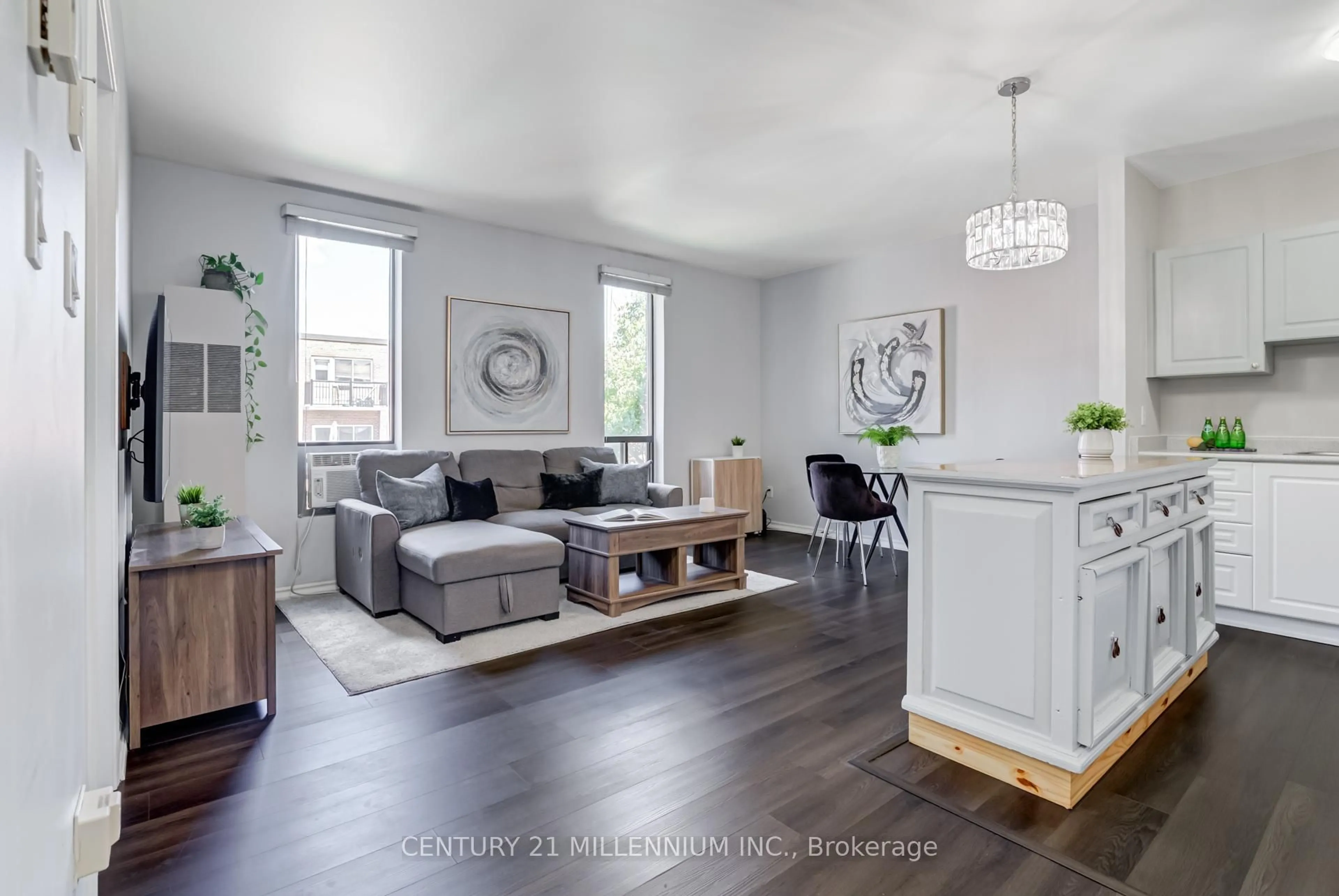 Living room with furniture, wood/laminate floor for 70 First St #206, Orangeville Ontario L9W 2E5