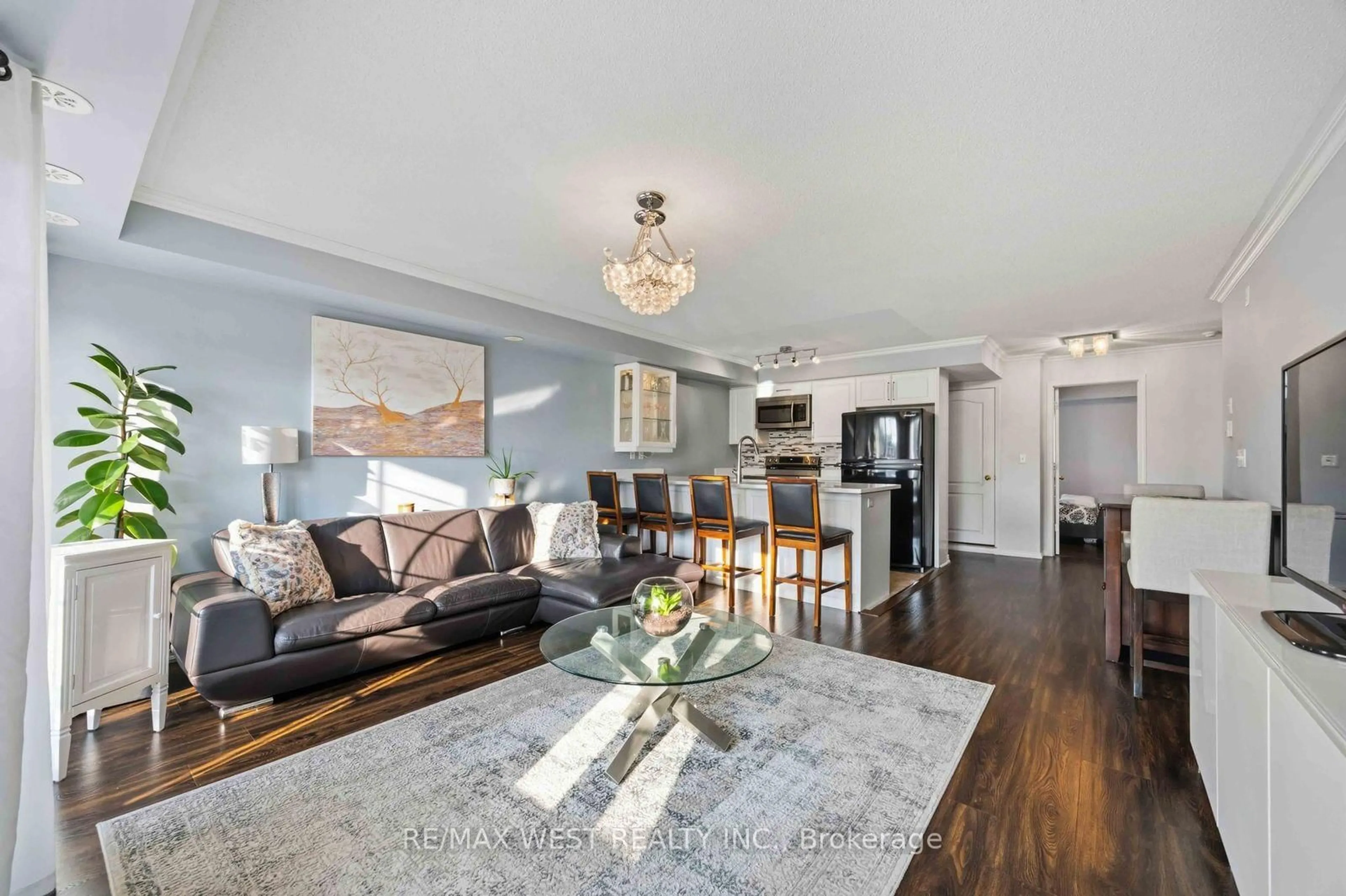 Living room with furniture, wood/laminate floor for 133 Isaac Devins Blvd #6, Toronto Ontario M9M 0C4