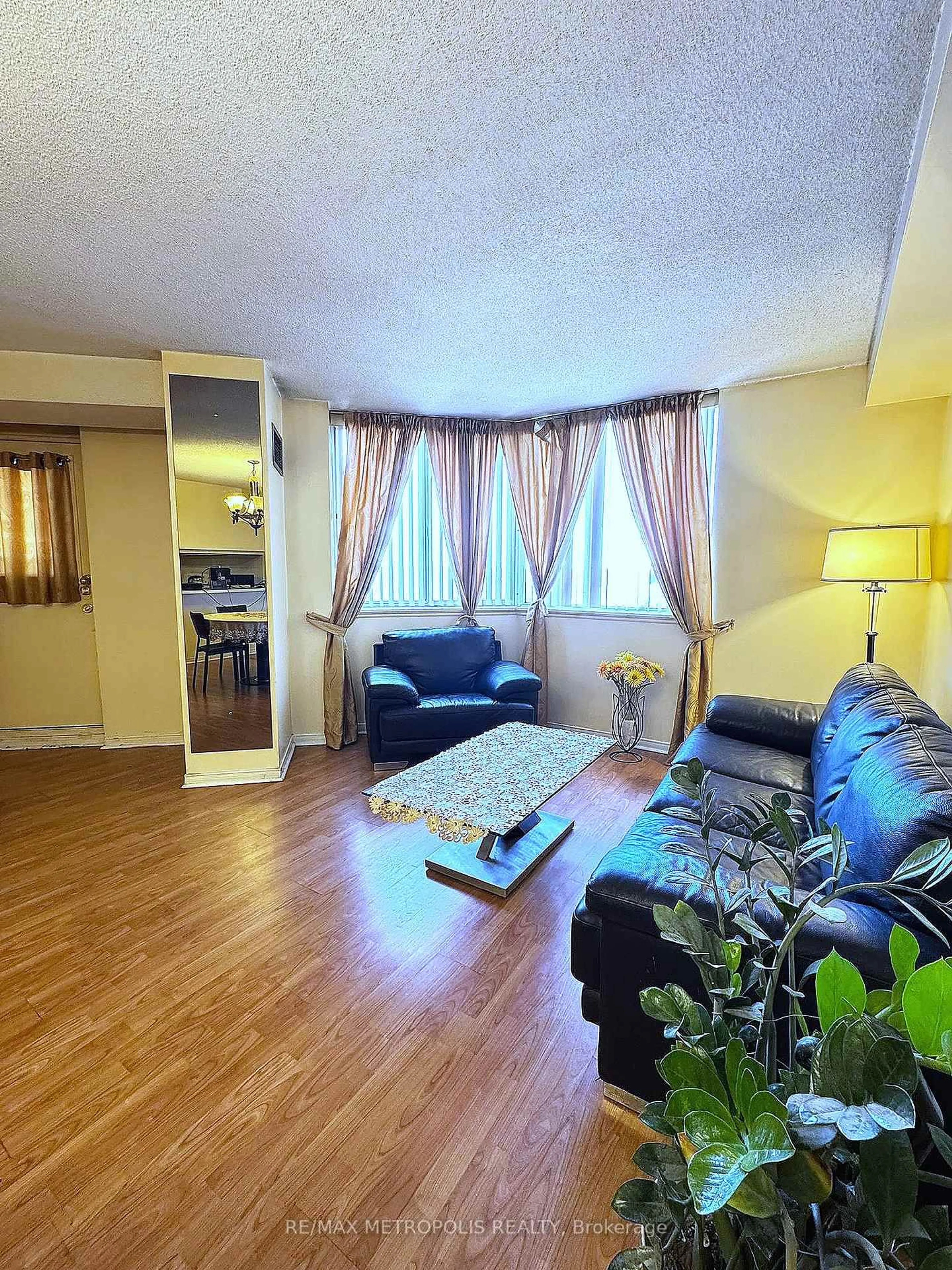 Living room with furniture, wood/laminate floor for 234 Albion Rd #806, Toronto Ontario M9W 6A5