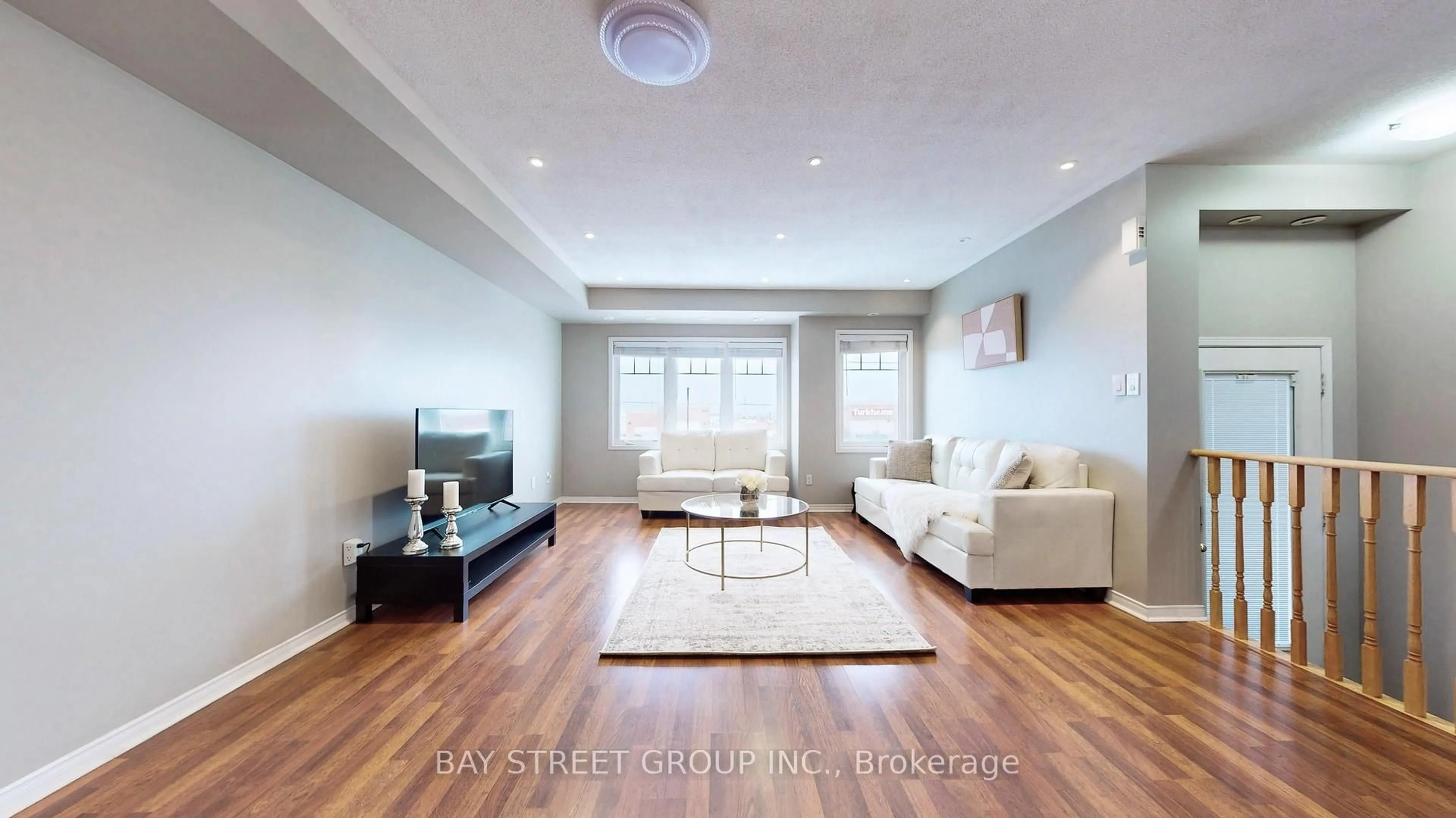 Living room with furniture, wood/laminate floor for 3975 Eglinton Ave #13, Mississauga Ontario L5M 0E7