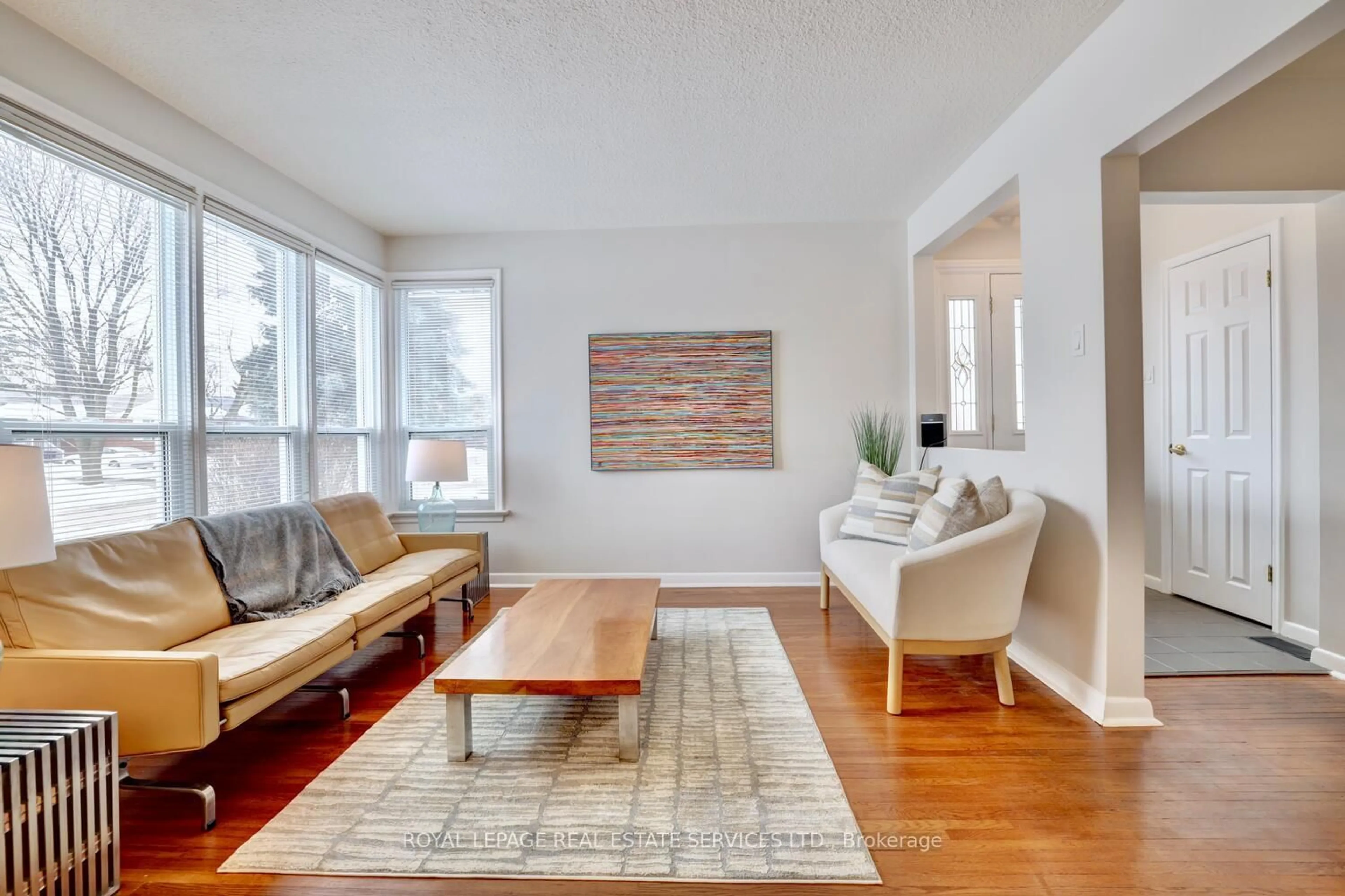 Living room with furniture, wood/laminate floor for 4 Duncairn Dr, Toronto Ontario M9B 2P2