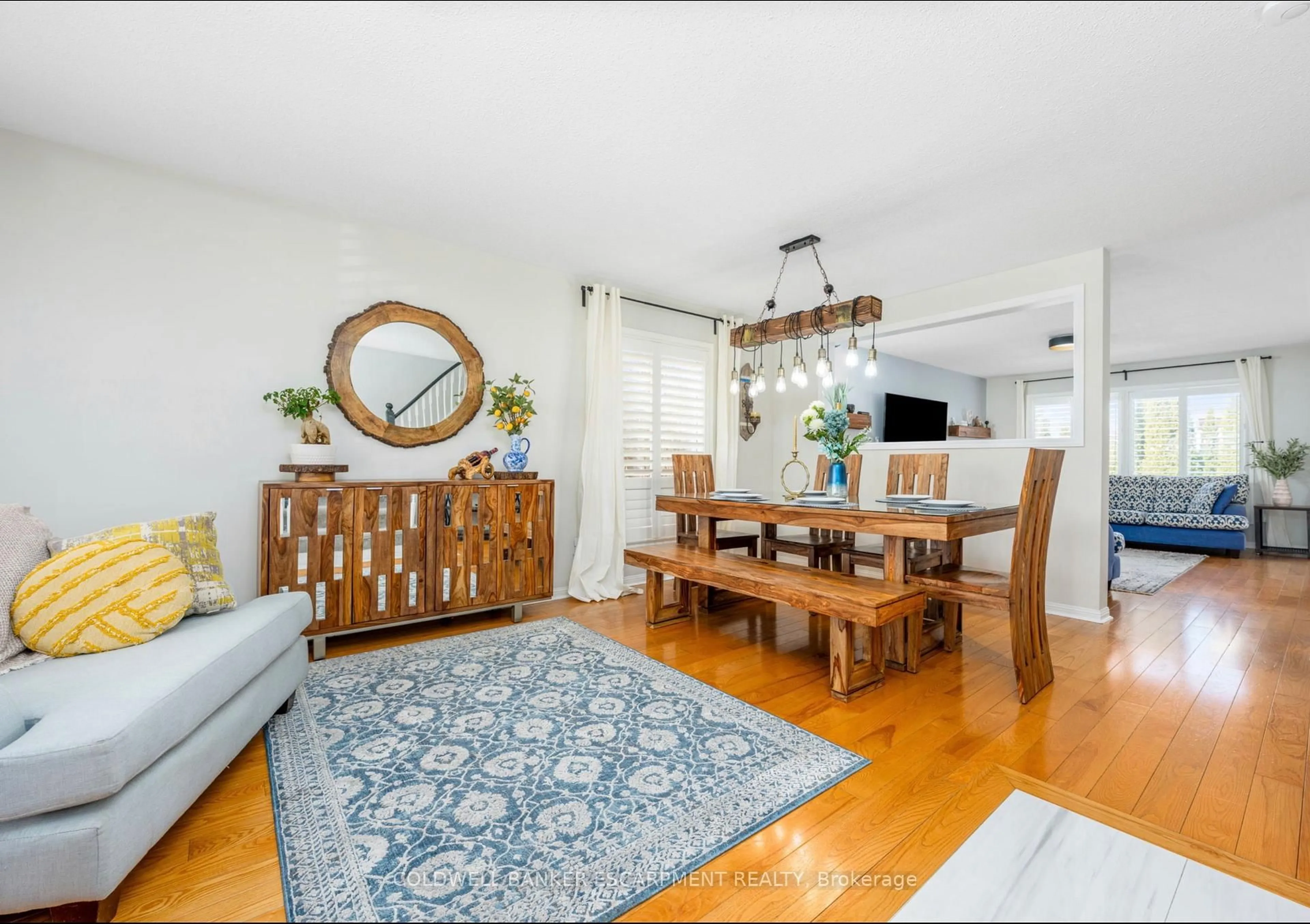 Living room with furniture, wood/laminate floor for 420 Trudeau Dr, Milton Ontario L9T 5K9