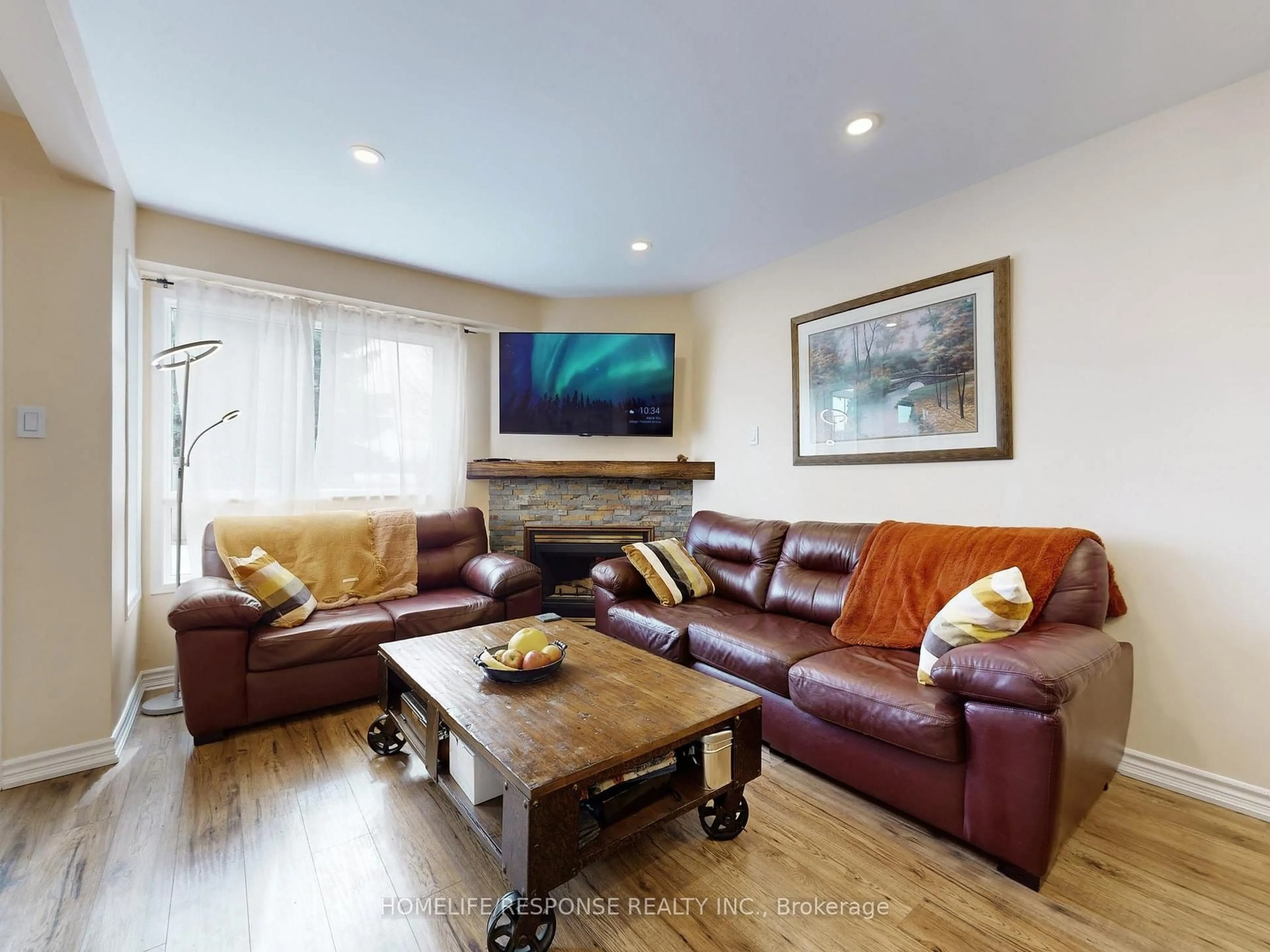 Living room with furniture, wood/laminate floor for 5134 Lampman Ave, Burlington Ontario L7L 6L1