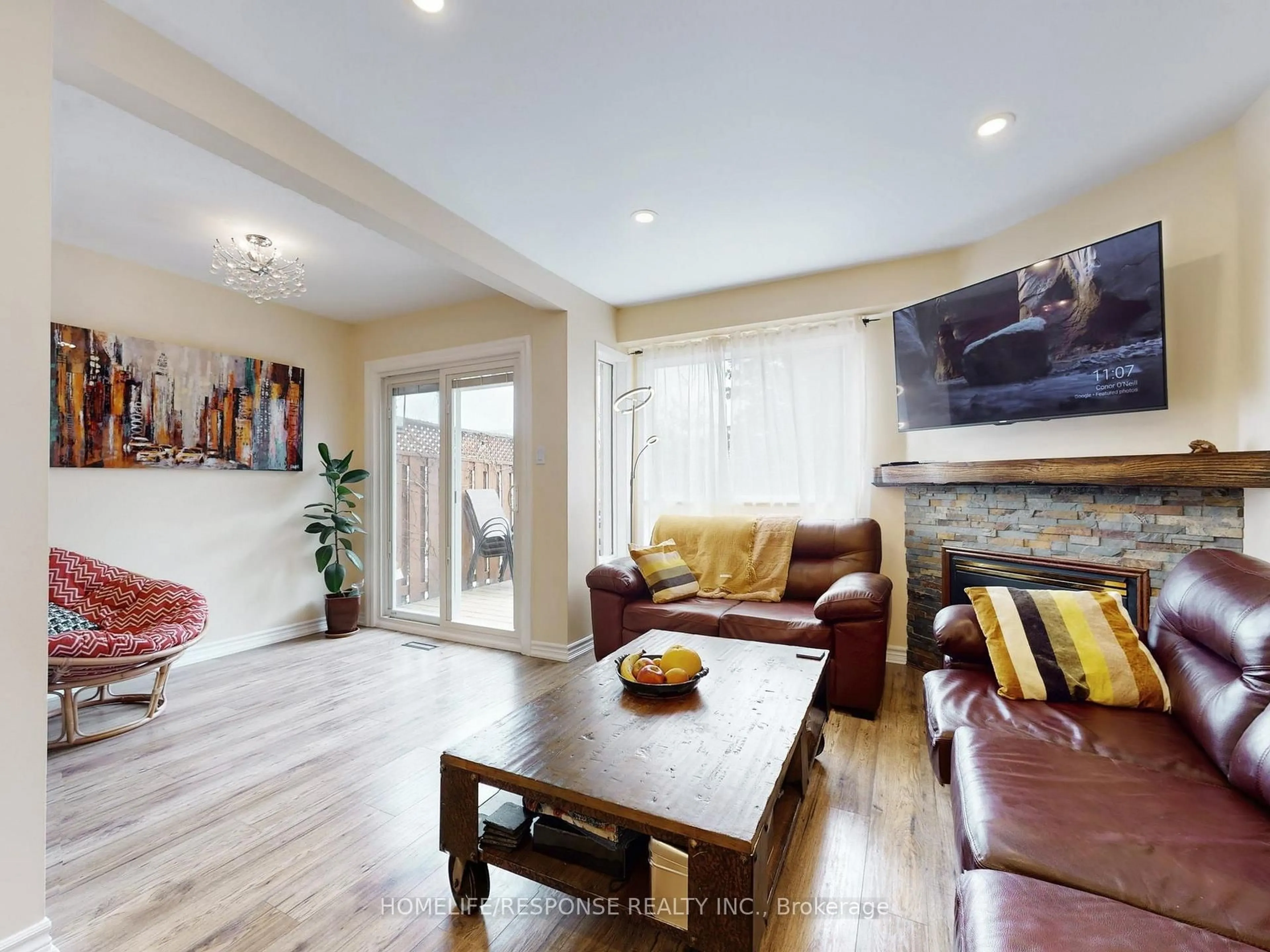 Living room with furniture, wood/laminate floor for 5134 Lampman Ave, Burlington Ontario L7L 6L1