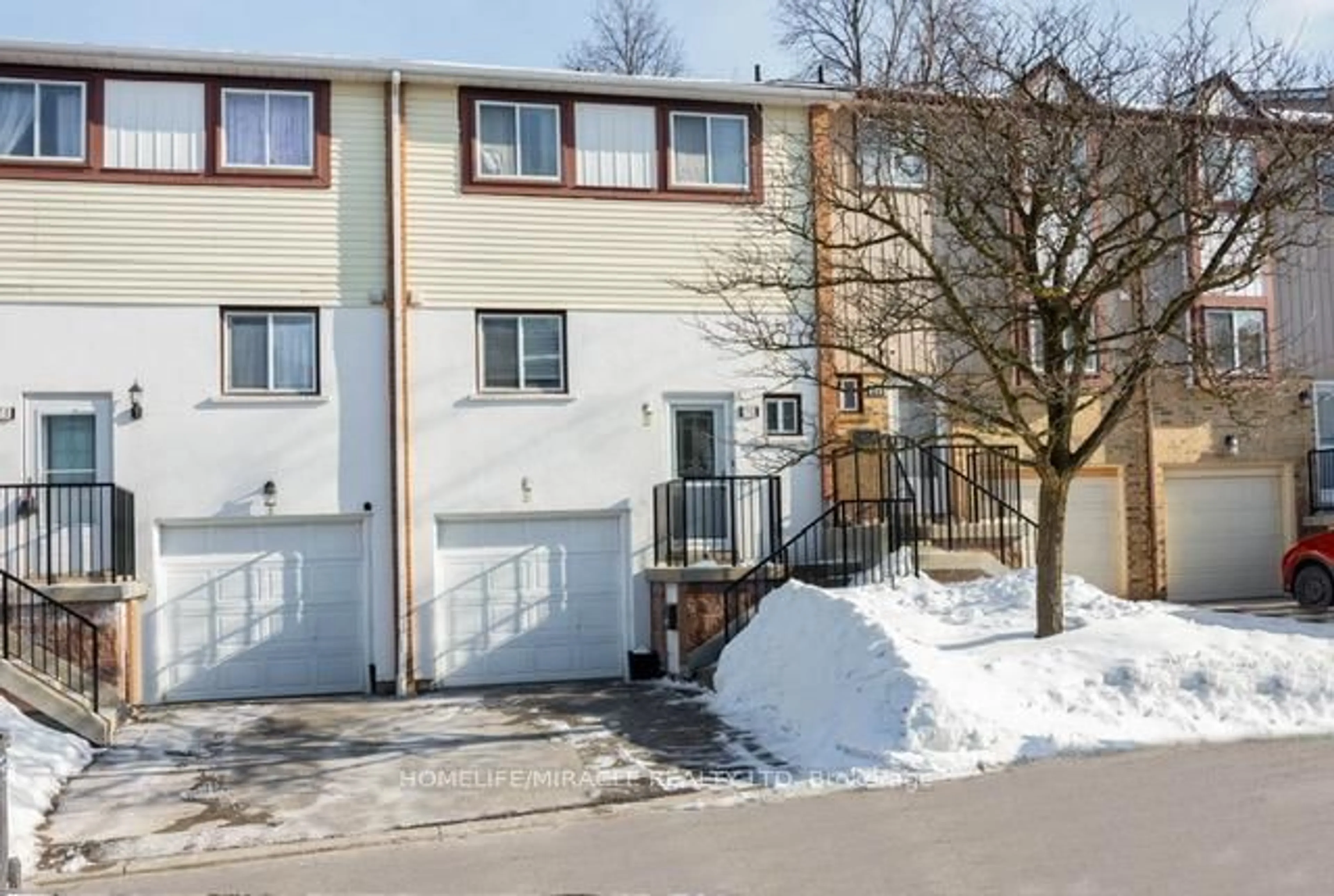 A pic from outside/outdoor area/front of a property/back of a property/a pic from drone, street for 70 Moregate Cres #51, Brampton Ontario L6S 3K9