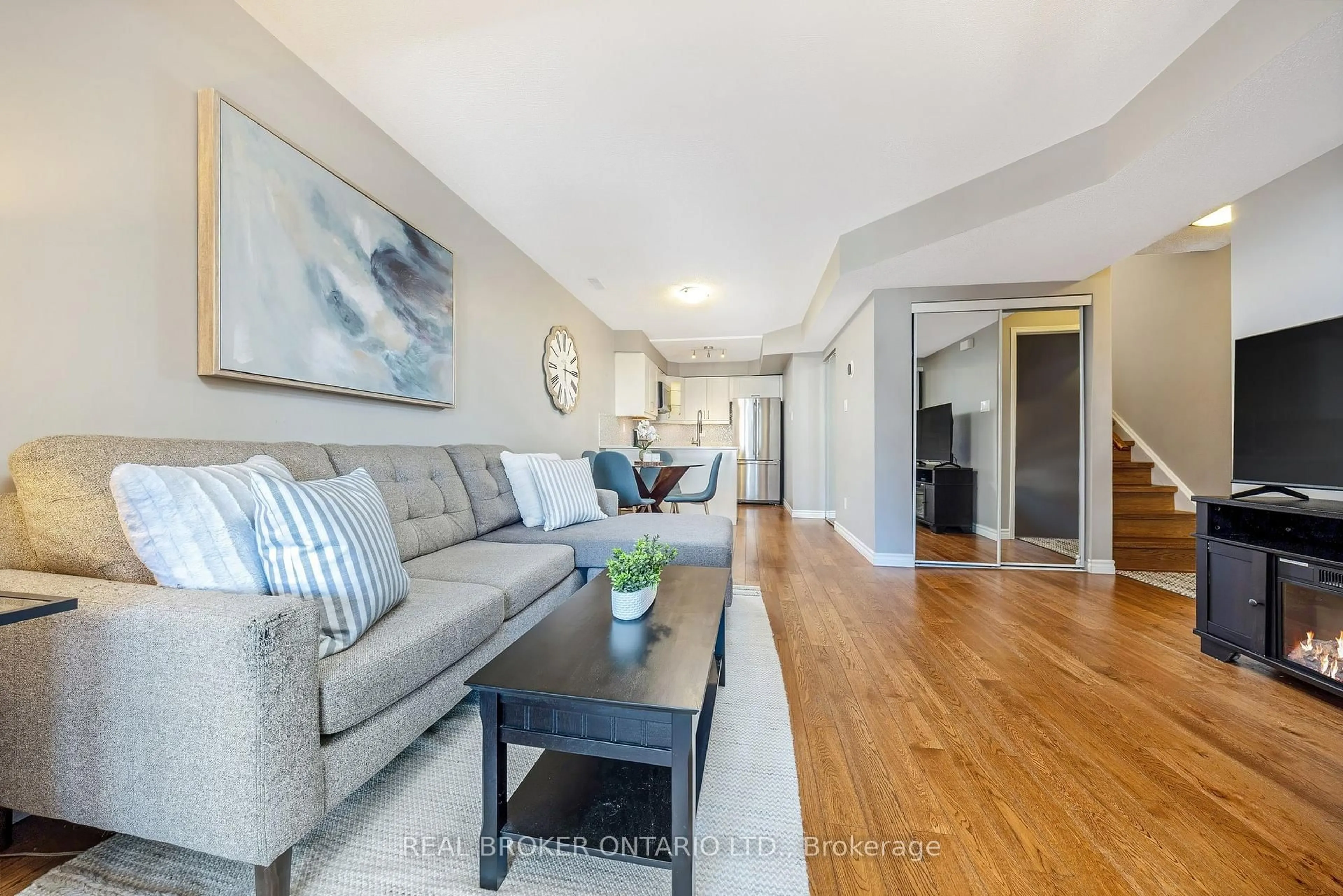 Living room with furniture, wood/laminate floor for 80A Stewart Maclaren Rd, Halton Hills Ontario L7G 5L9