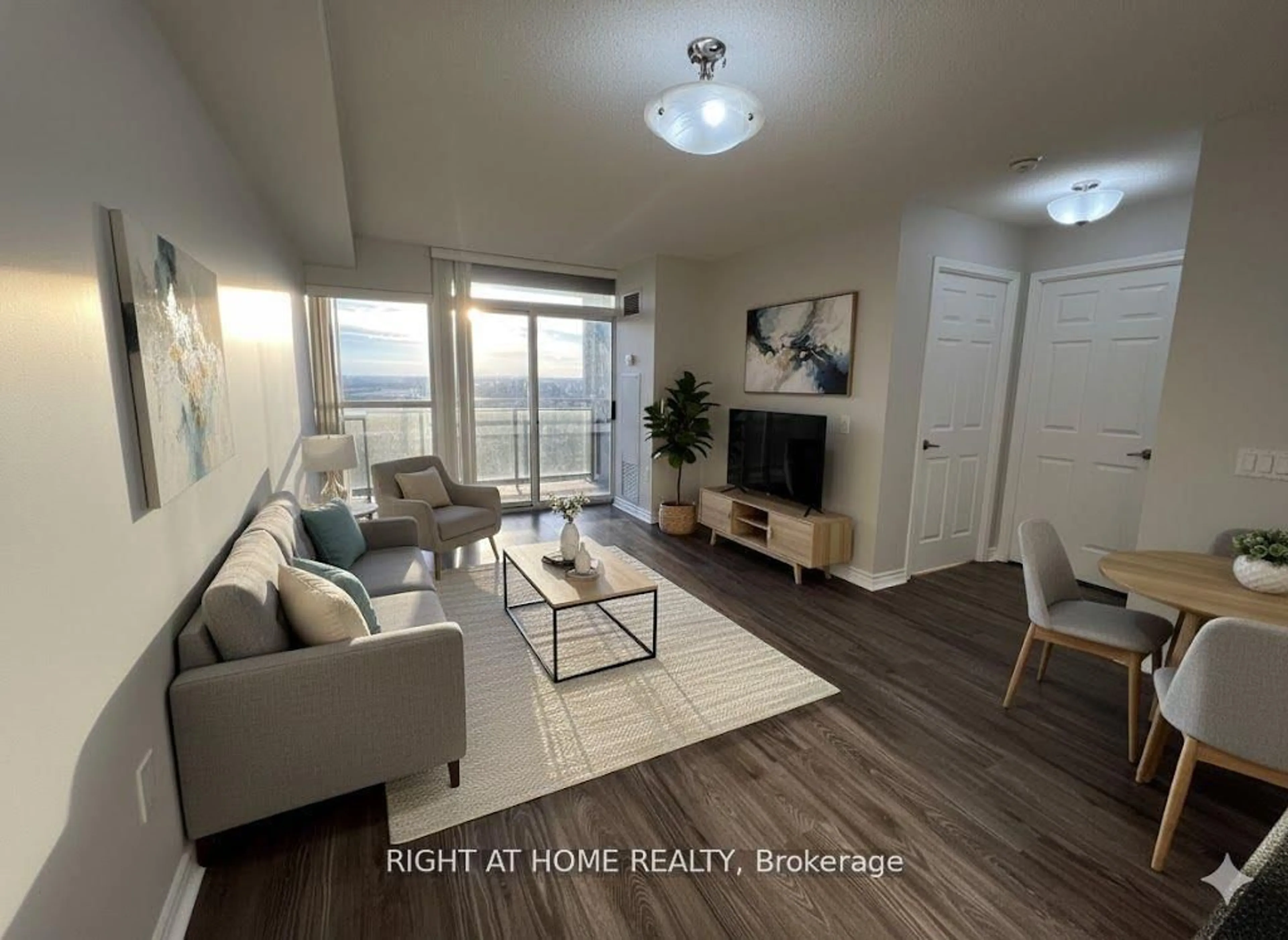 Living room with furniture, wood/laminate floor for 55 Strathaven Dr #1808, Mississauga Ontario L5R 4G9