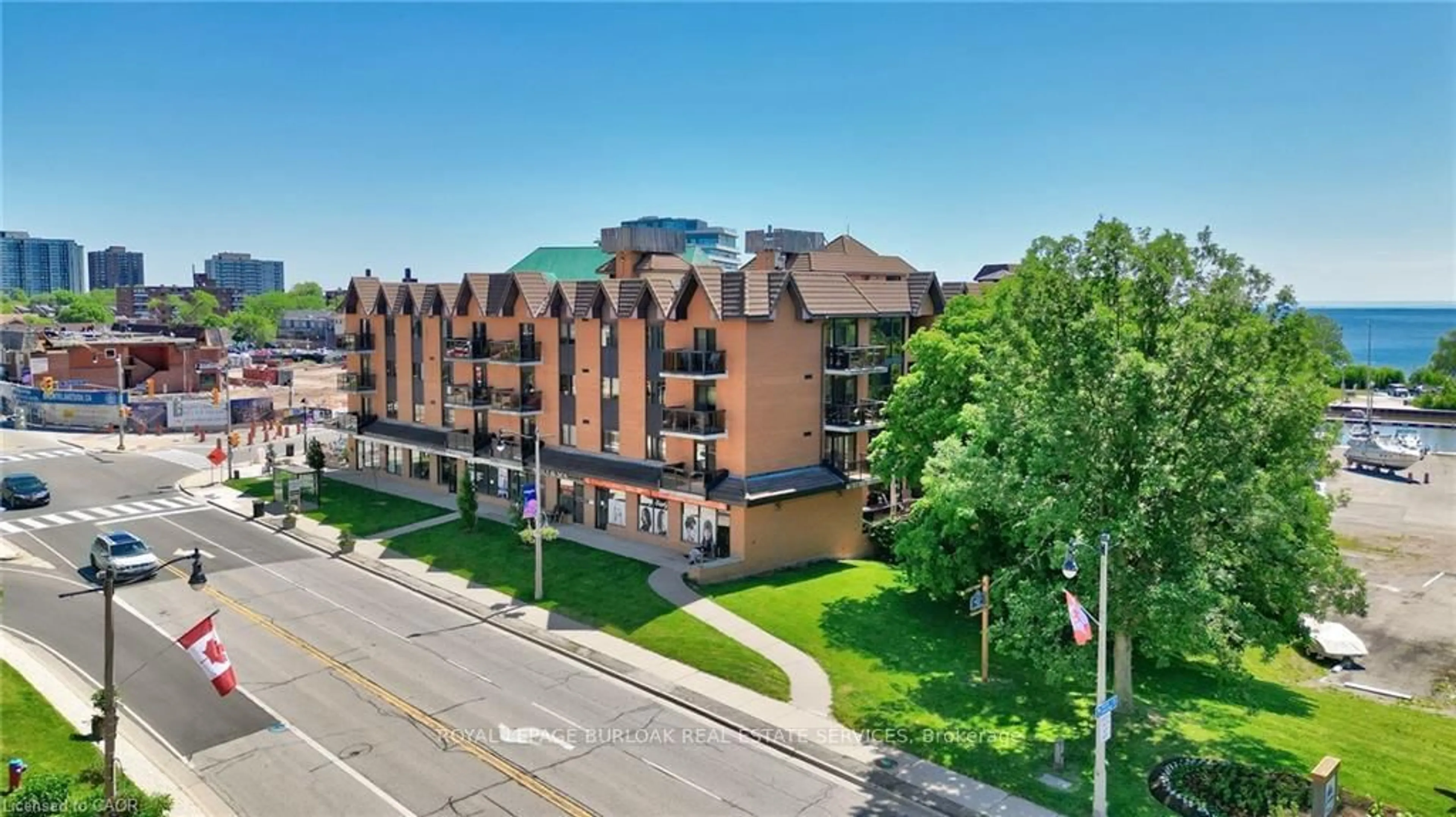 A pic from outside/outdoor area/front of a property/back of a property/a pic from drone, unknown for 102 Bronte Rd #303, Oakville Ontario L6L 6J5