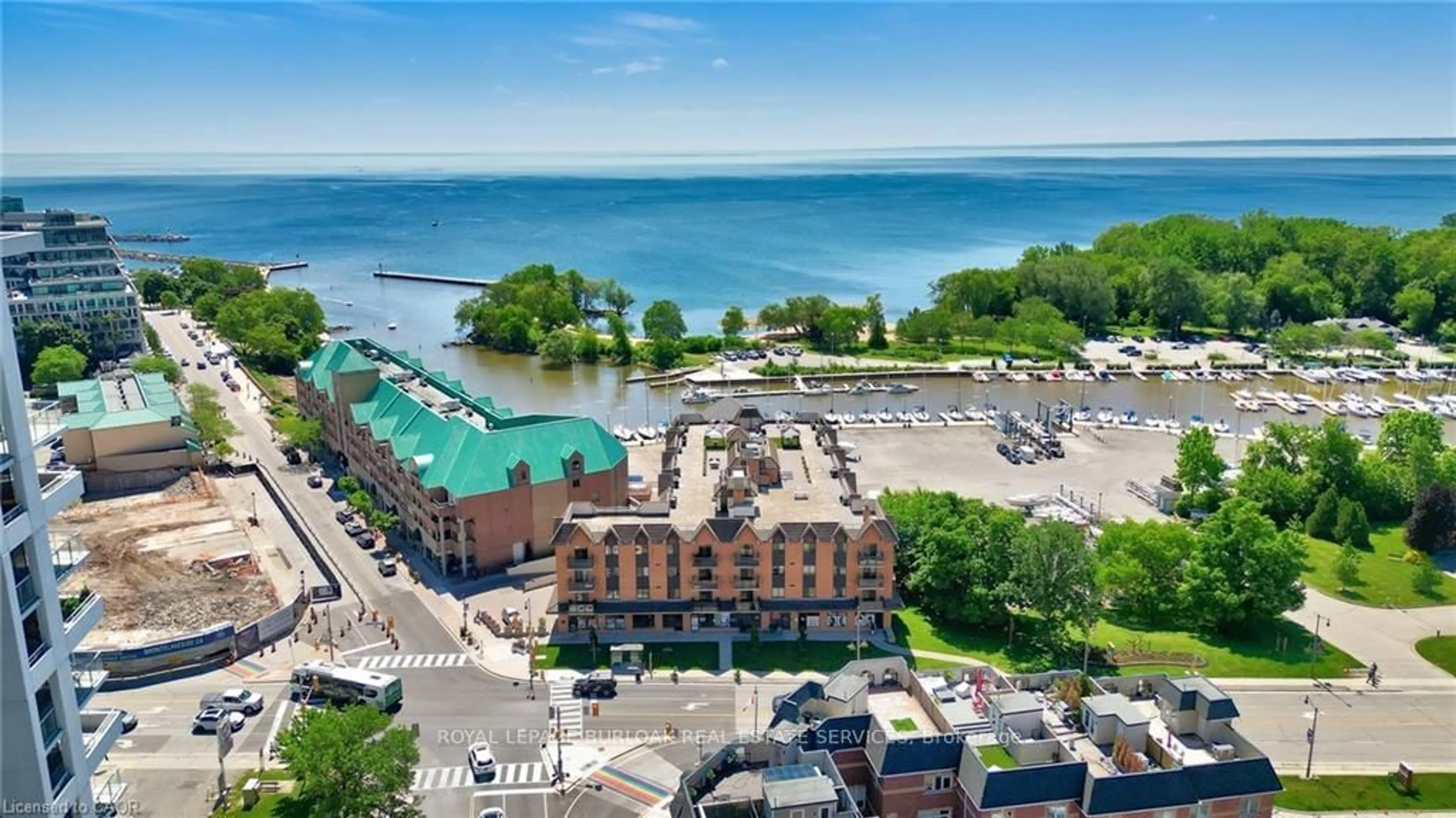 A pic from outside/outdoor area/front of a property/back of a property/a pic from drone, water/lake/river/ocean view for 102 Bronte Rd #303, Oakville Ontario L6L 6J5