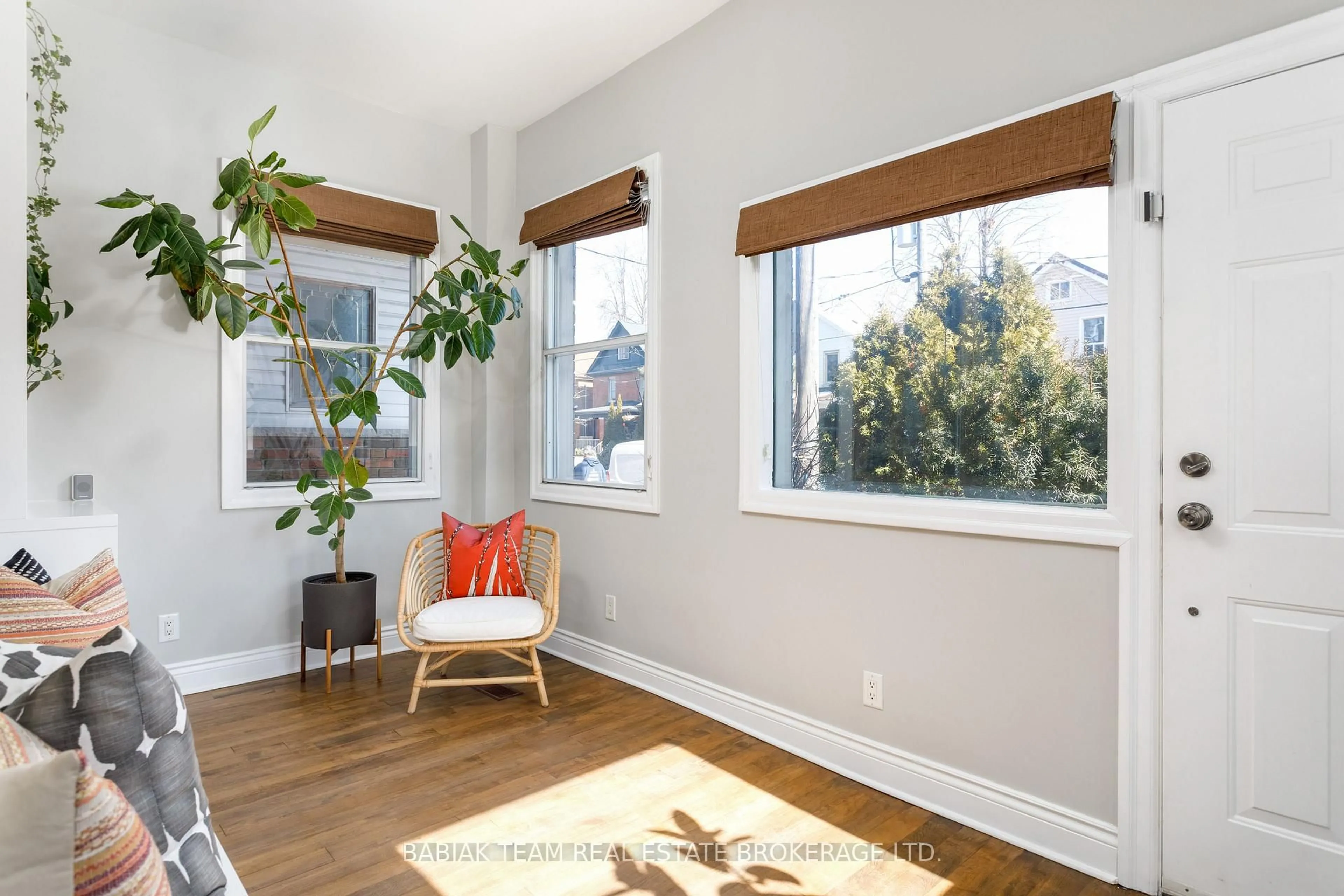 Living room with furniture, wood/laminate floor for 530 Runnymede Rd, Toronto Ontario M6S 2Z7