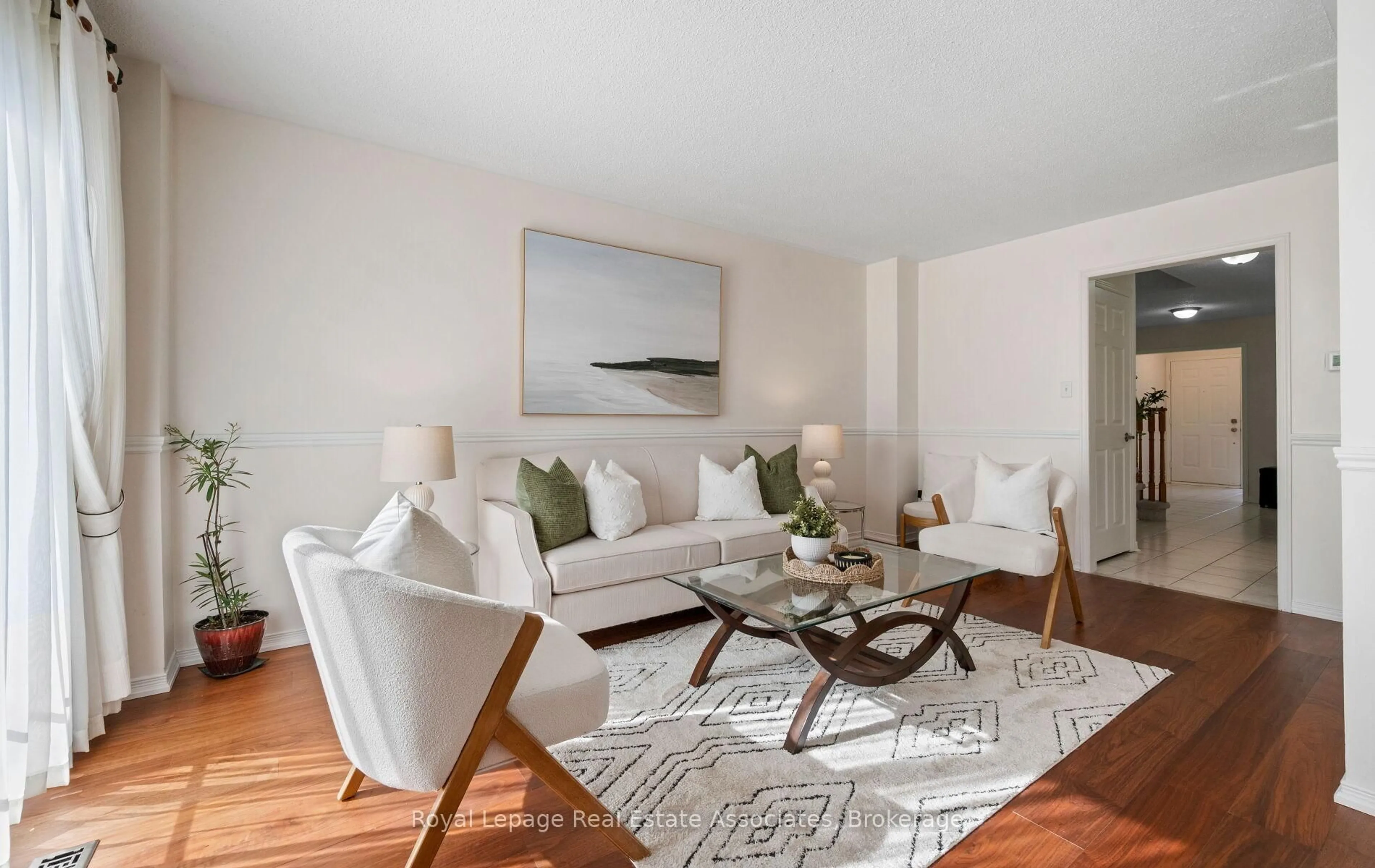 Living room with furniture, wood/laminate floor for 144 Genesee Dr, Oakville Ontario L6H 5Y9