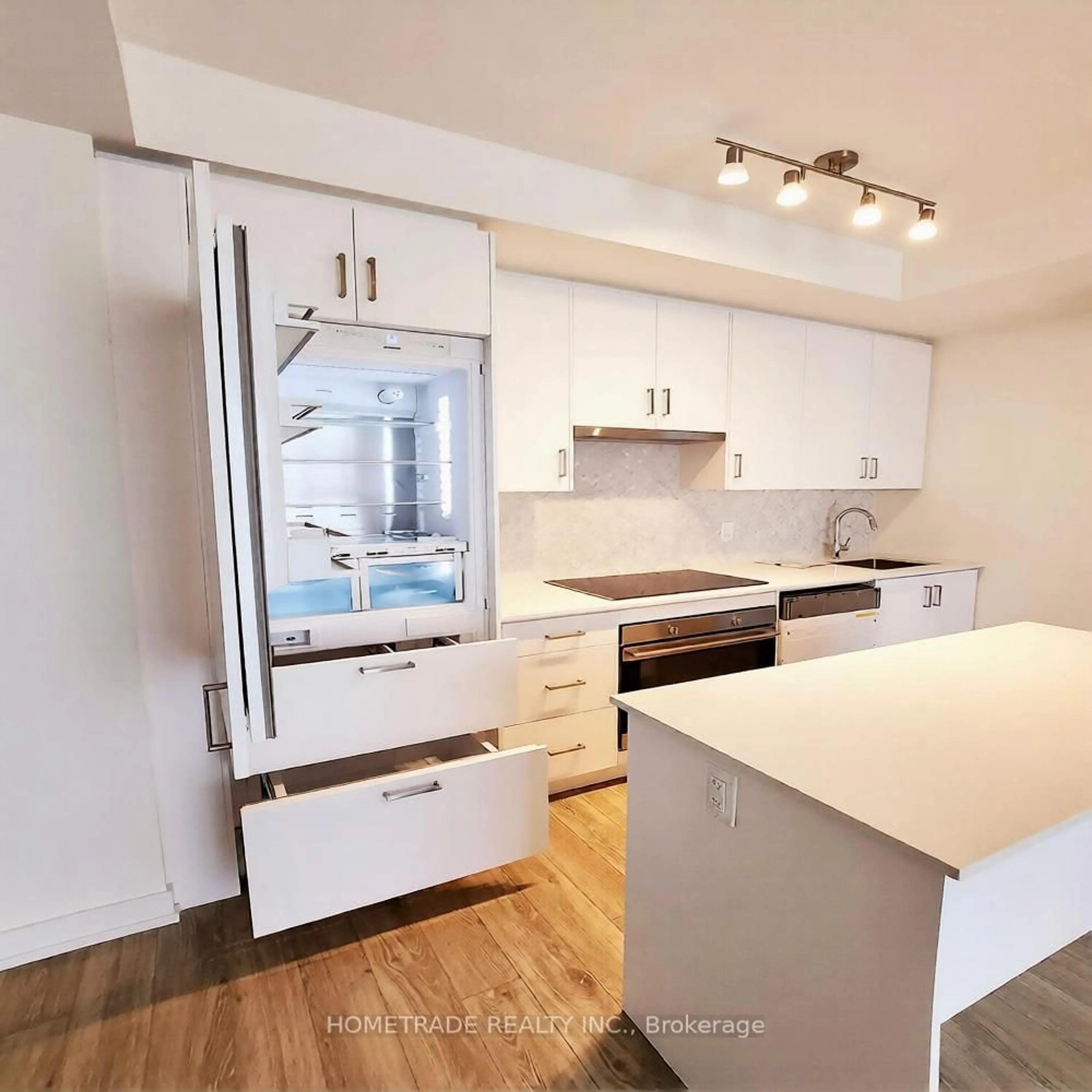 Open concept kitchen, wood/laminate floor for 335 Wheat Boom Dr #803, Oakville Ontario L6H 7Y1