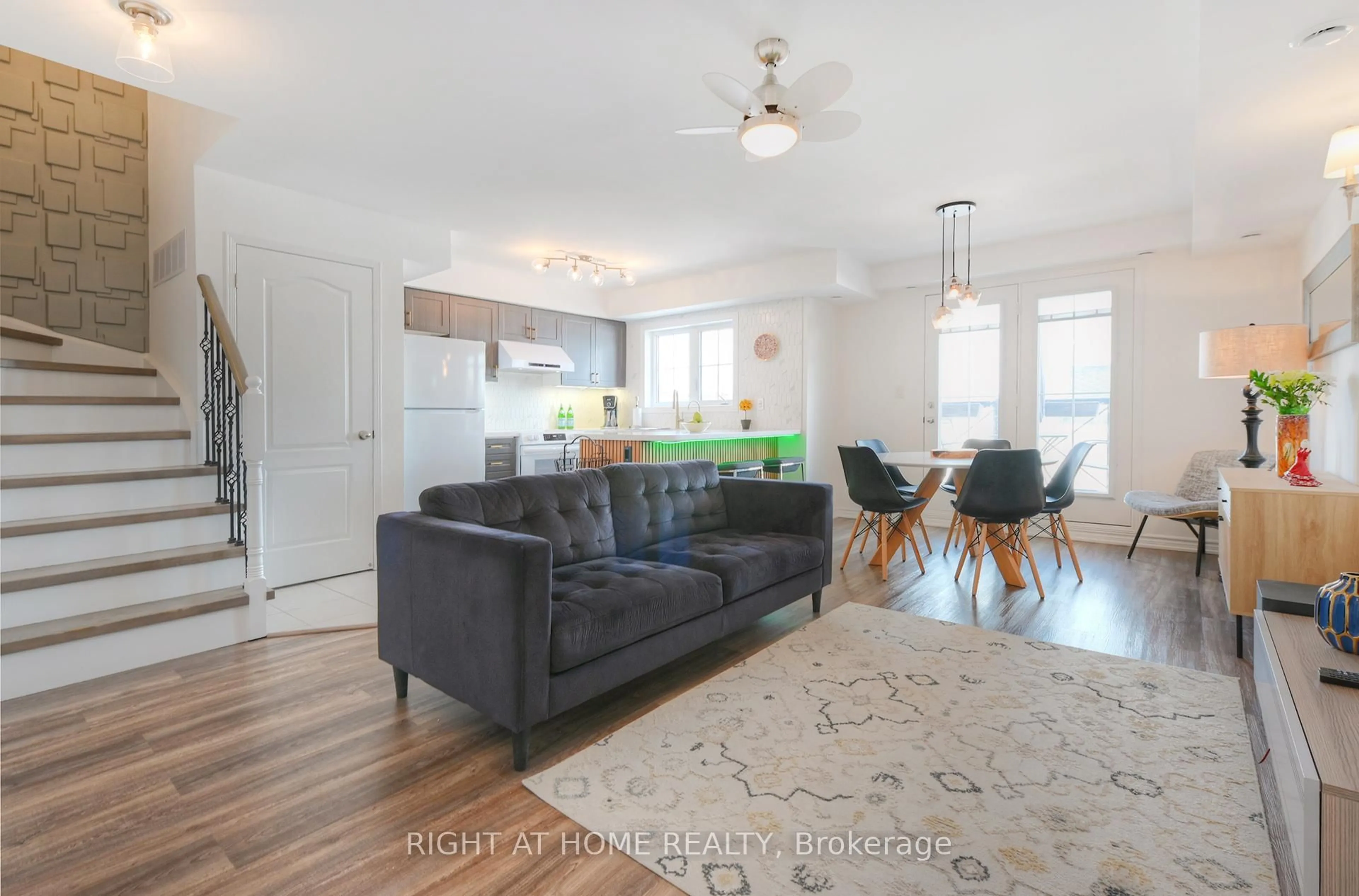 Living room with furniture, wood/laminate floor for 2450 Post Rd #14, Oakville Ontario L6H 0J2