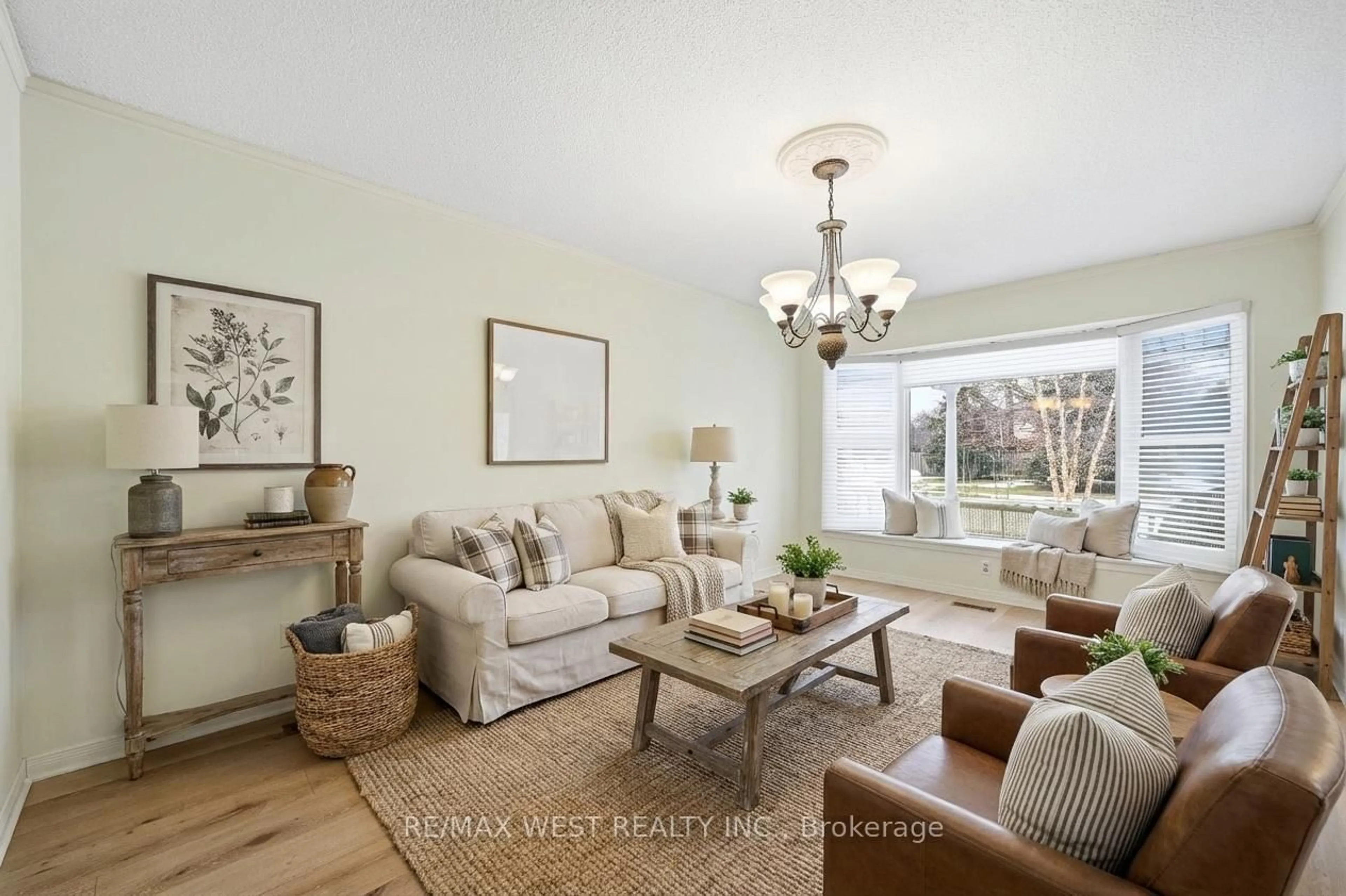 Living room with furniture, wood/laminate floor for 690 Robertson Cres, Milton Ontario L9T 4V5