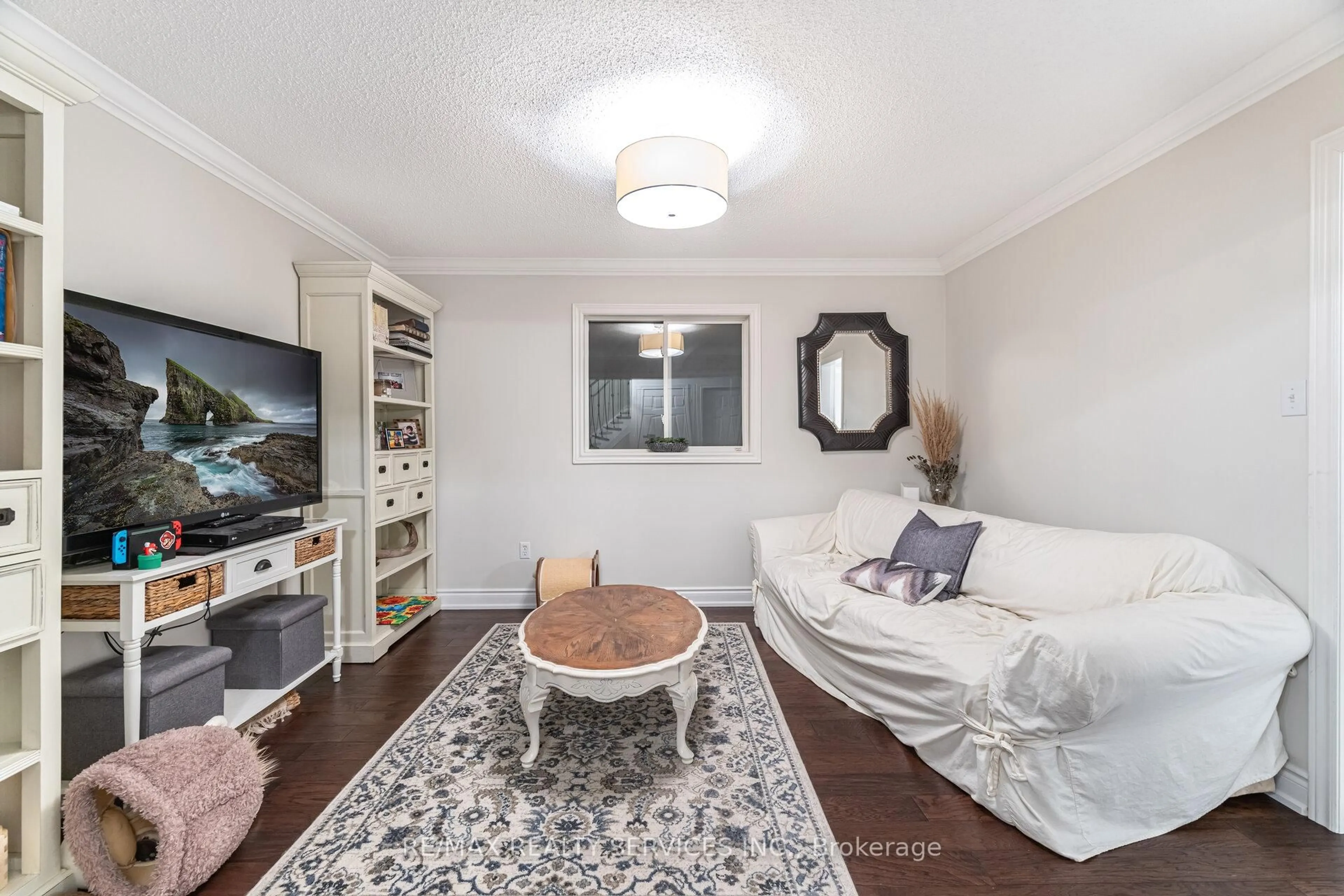 Living room with furniture, wood/laminate floor for 13 Emily Carr Cres, Caledon Ontario L7E 2L1