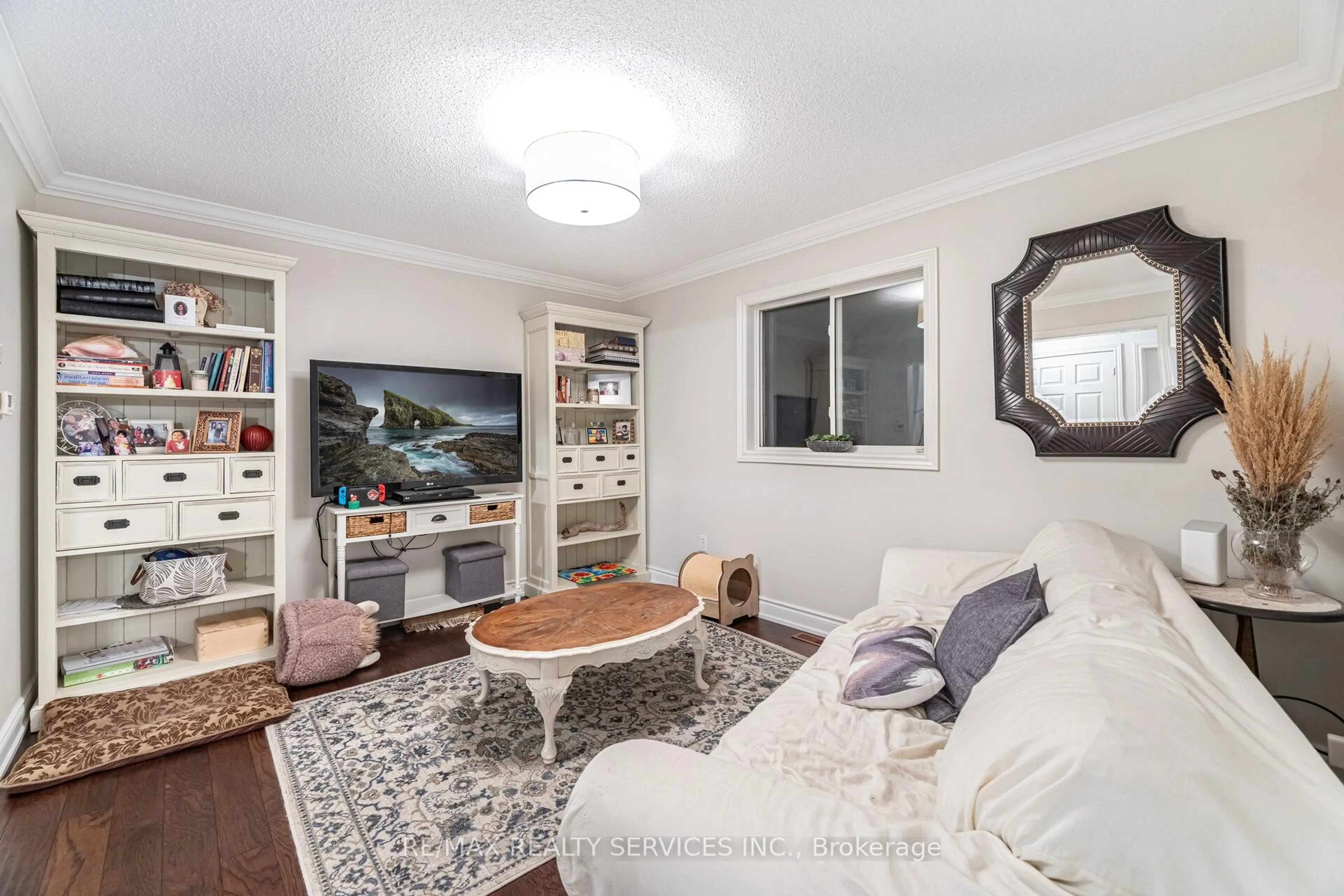 Living room with furniture, wood/laminate floor for 13 Emily Carr Cres, Caledon Ontario L7E 2L1