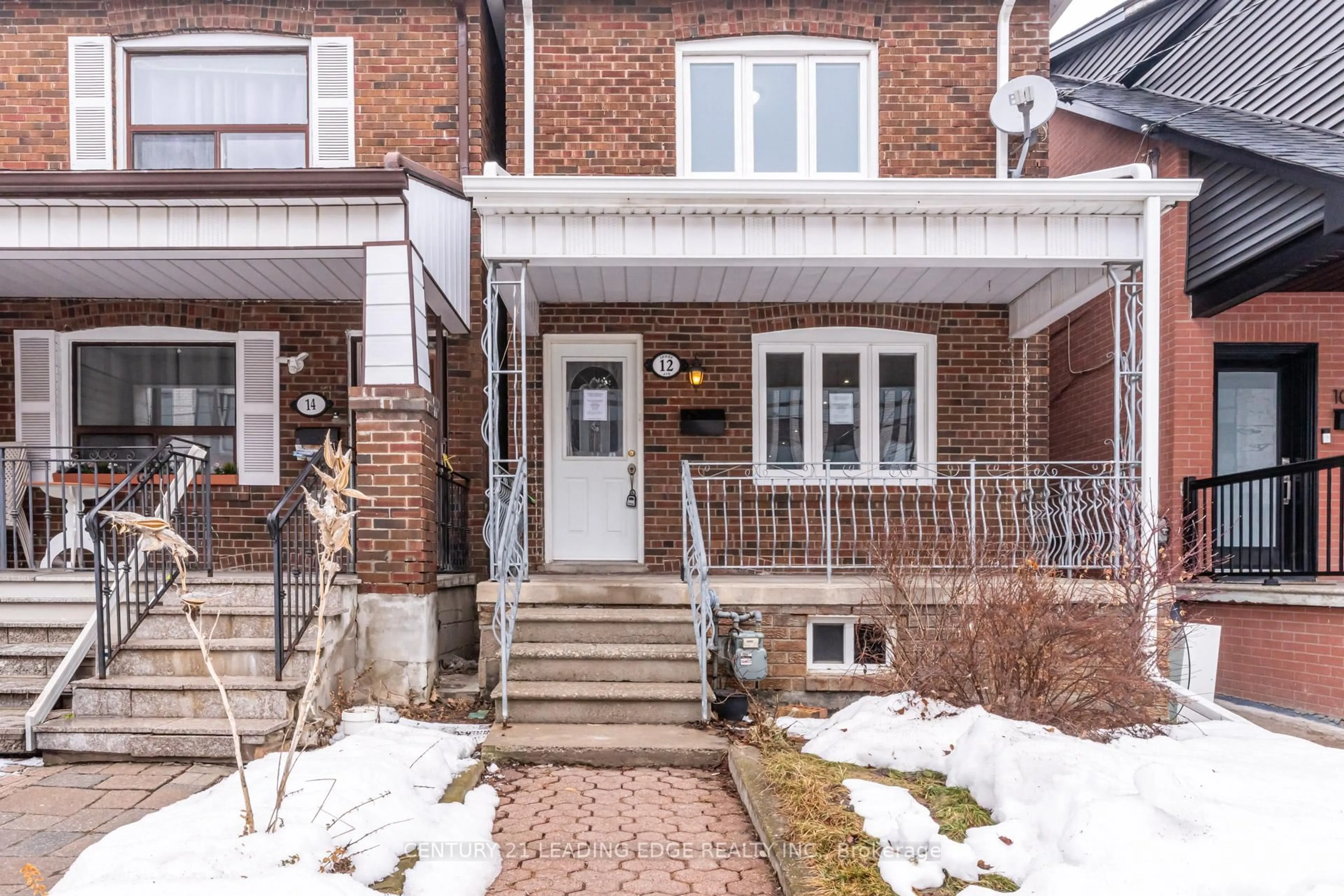 Home with brick exterior material, street for 12 Innes Ave, Toronto Ontario M6E 1M8